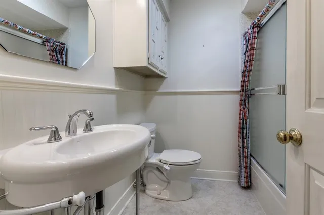 a bathroom with a sink and toilet