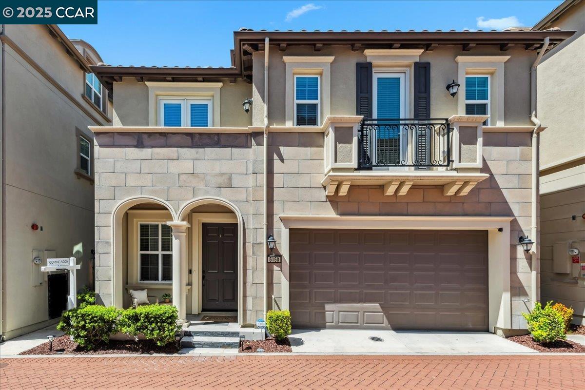 a front view of a house with yard