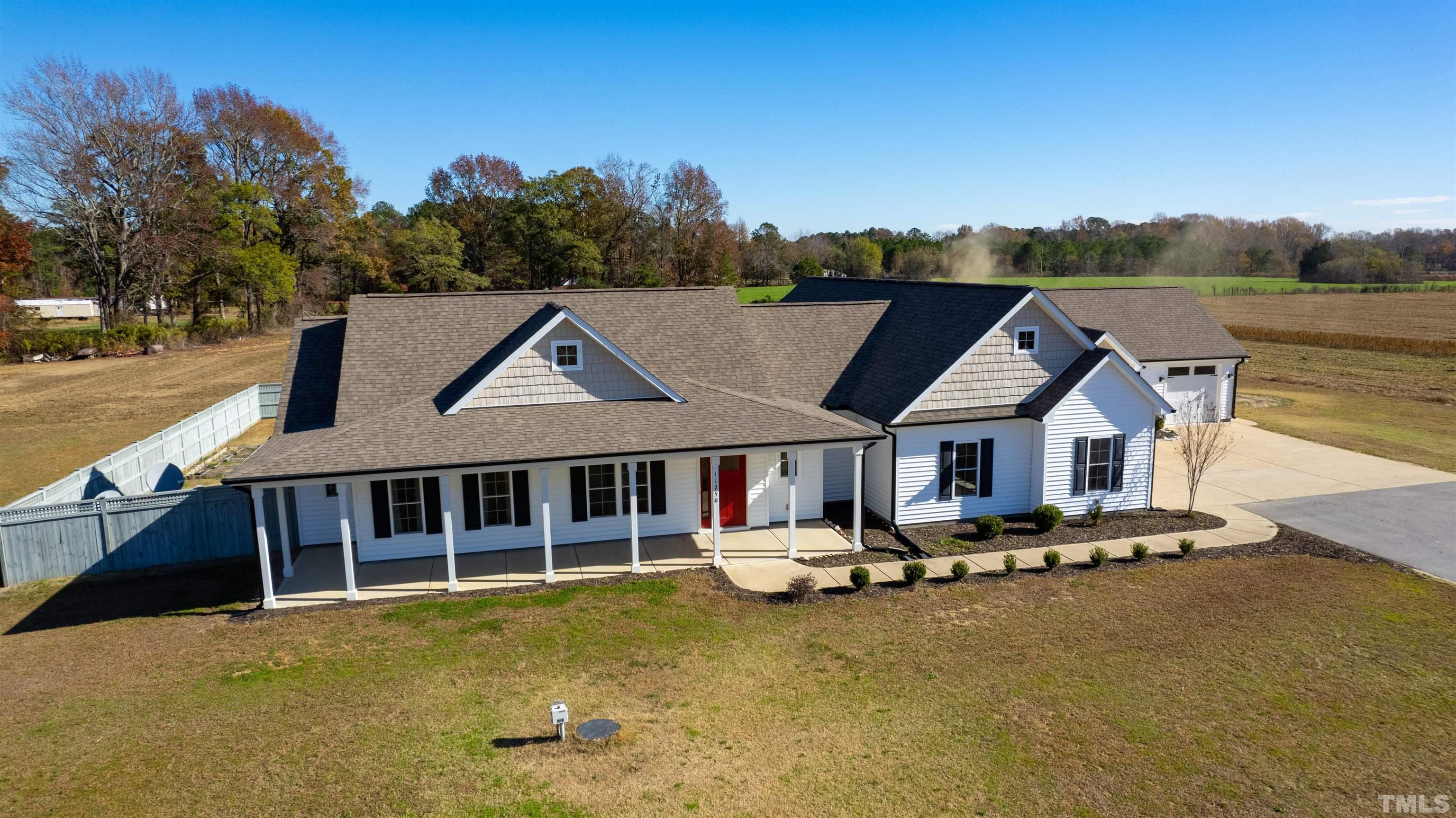 a view of a house with pool and sitting area