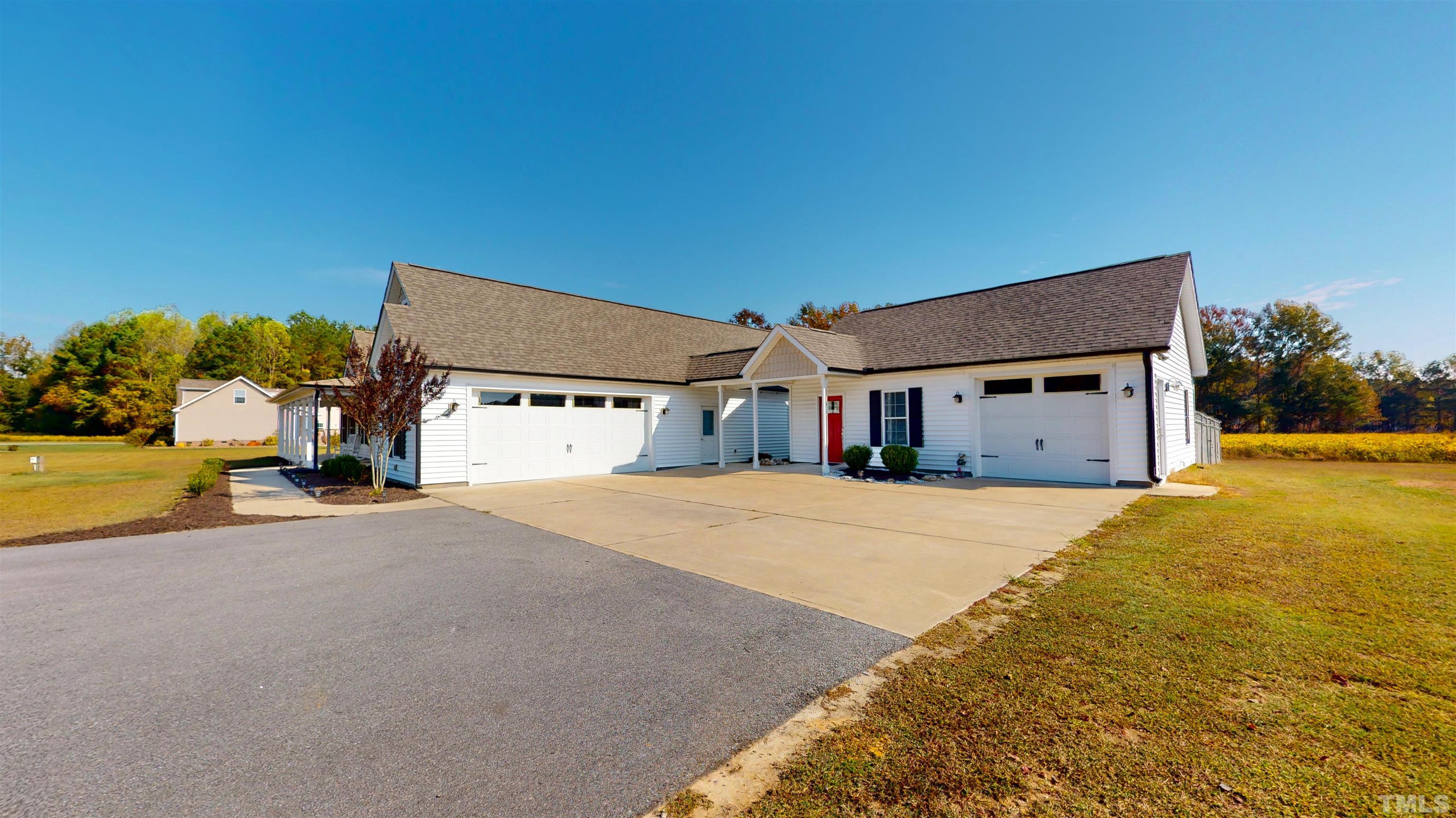 11250 Old Beulah Road Kenly, NC 27542 - Photo 11 of 66 a house with yard and a large parking space