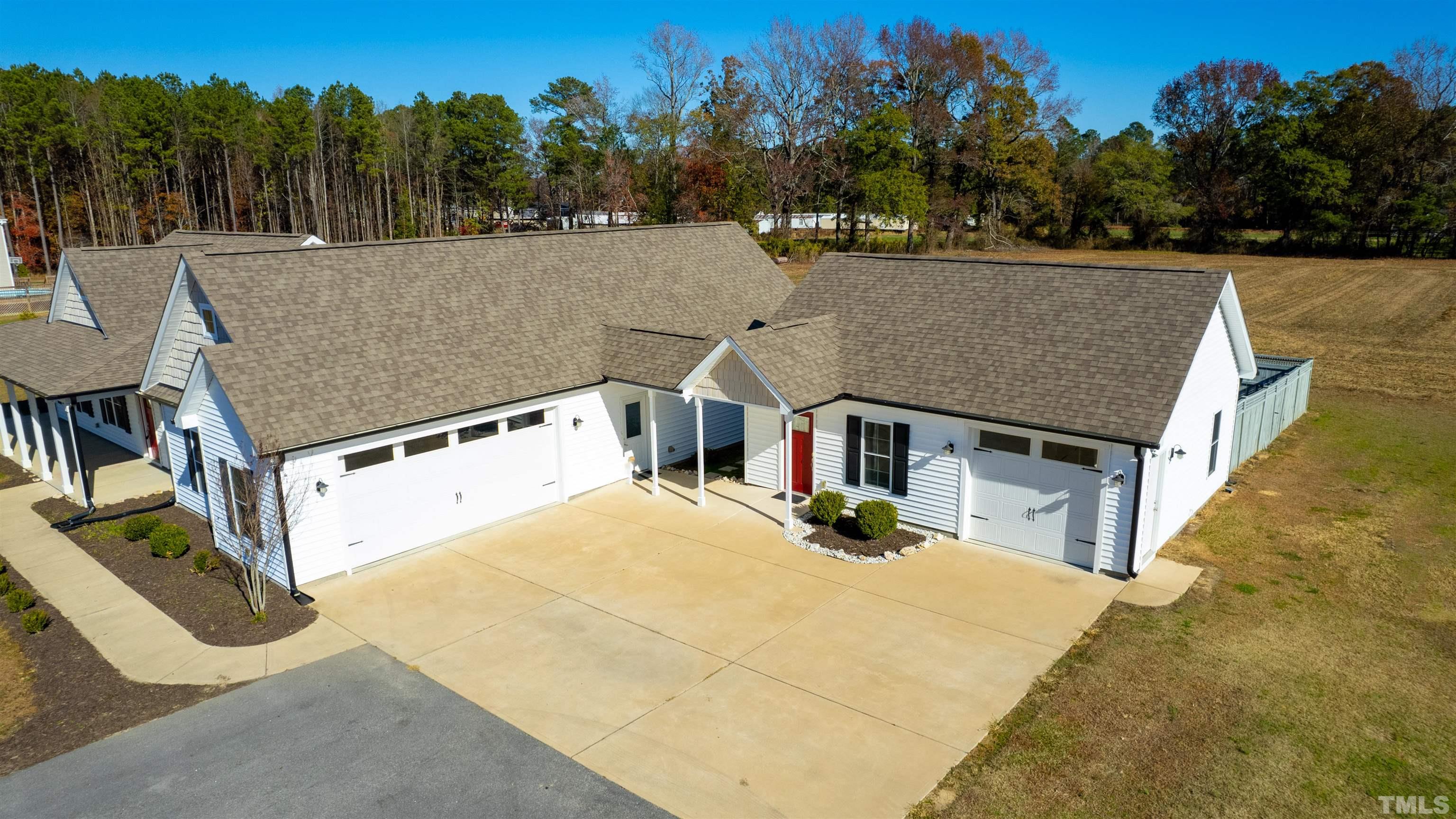 11250 Old Beulah Road Kenly, NC 27542 - Photo 2 of 66 a view of house with outdoor space and trees in the background