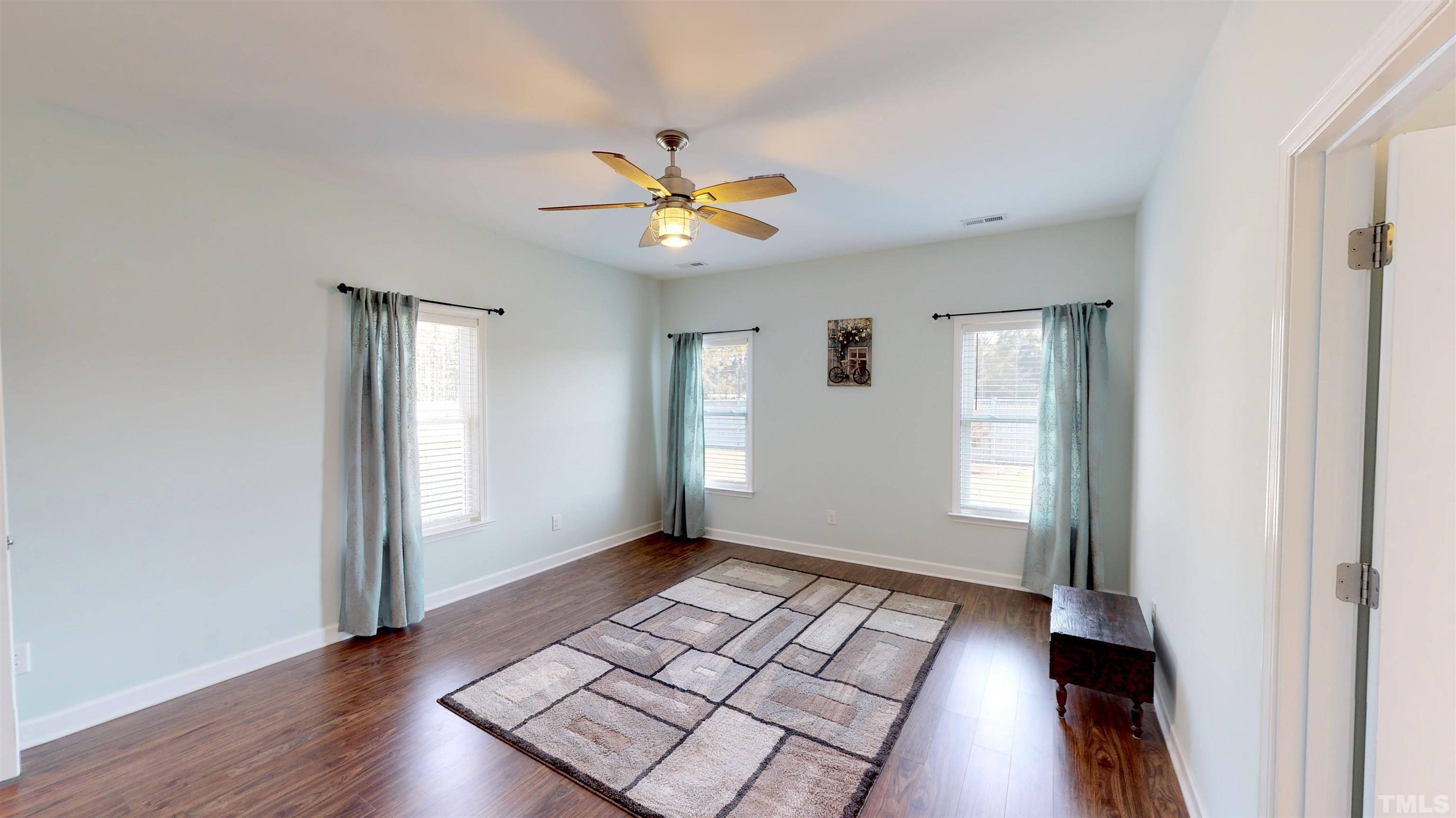 11250 Old Beulah Road Kenly, NC 27542 - Photo 27 of 66 wooden floor in an empty room with a window