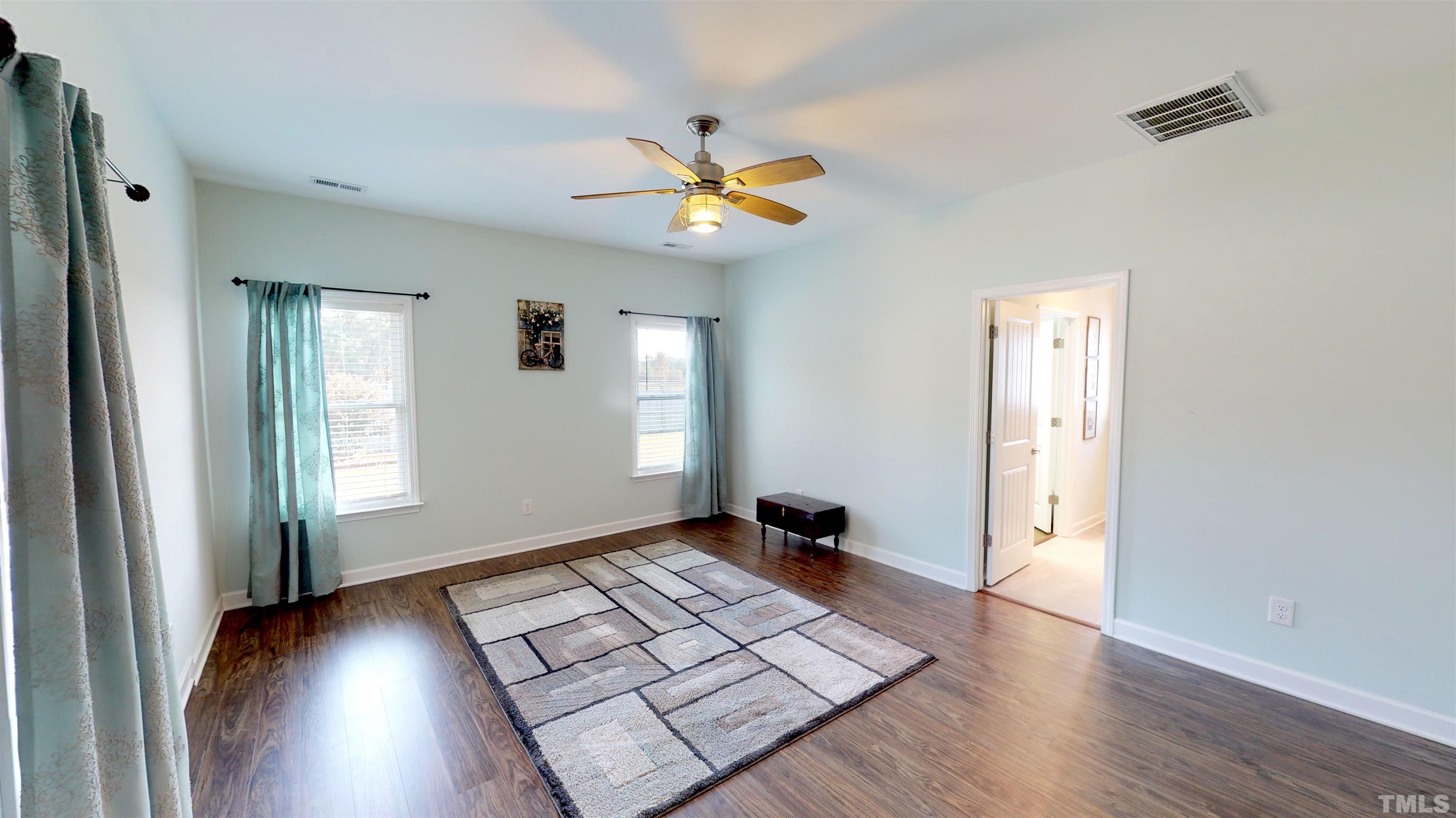 11250 Old Beulah Road Kenly, NC 27542 - Photo 28 of 66 a view of an empty room with window and wooden floor