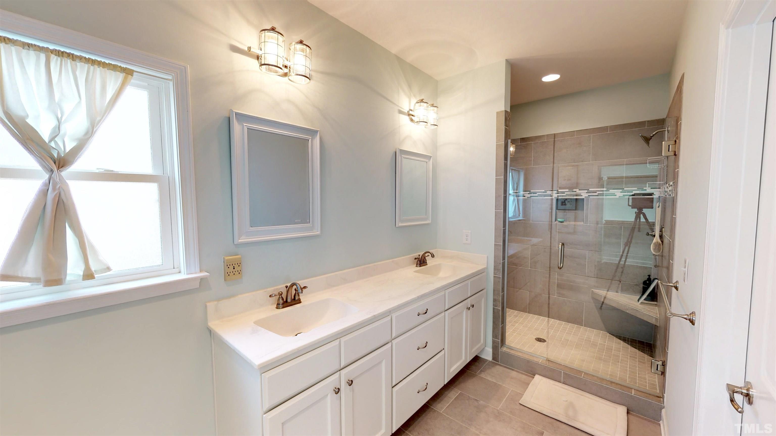 11250 Old Beulah Road Kenly, NC 27542 - Photo 29 of 66 a bathroom with a tub sink shower and mirror