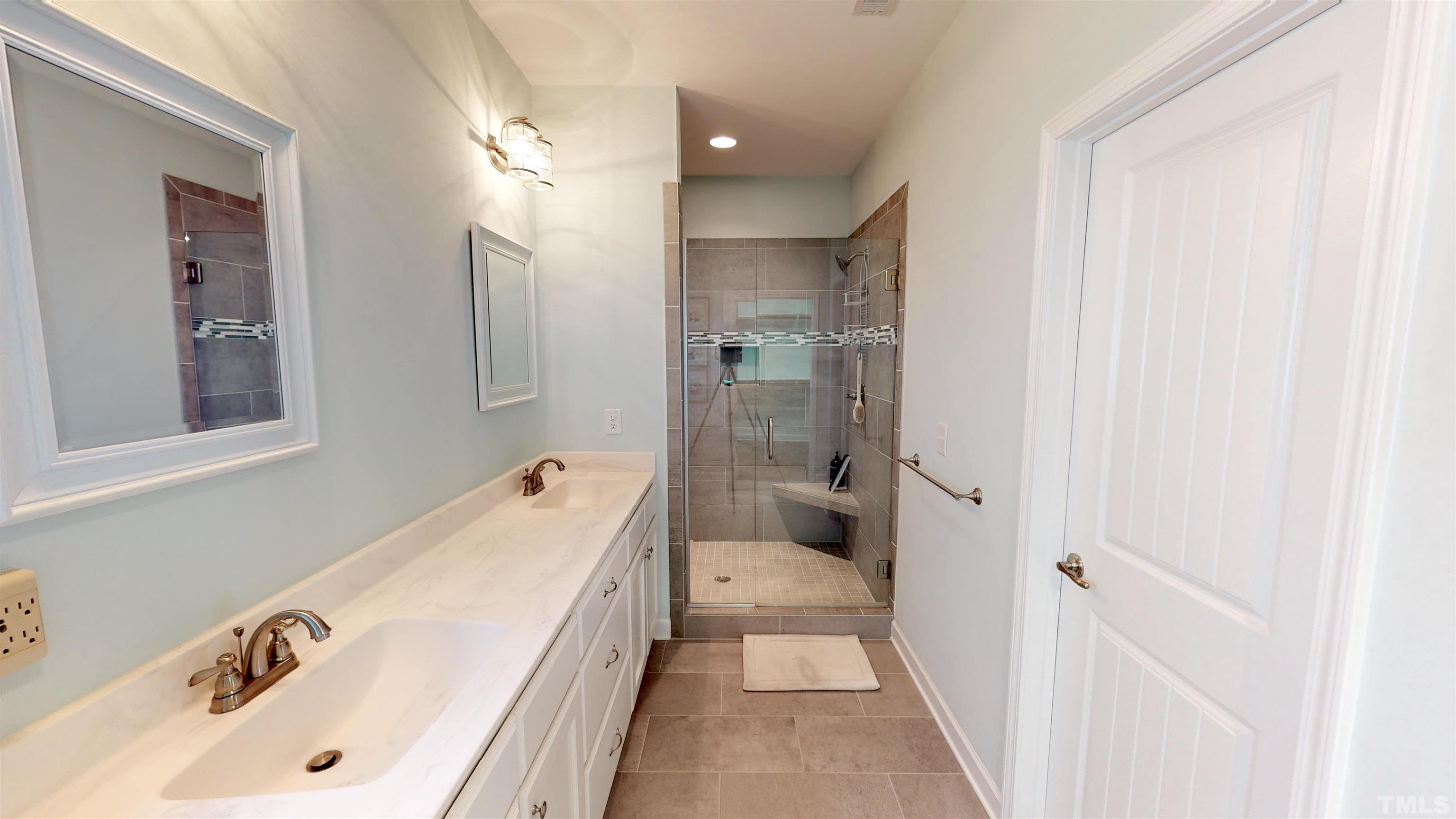 11250 Old Beulah Road Kenly, NC 27542 - Photo 30 of 66 a bathroom with a tub sink and mirror