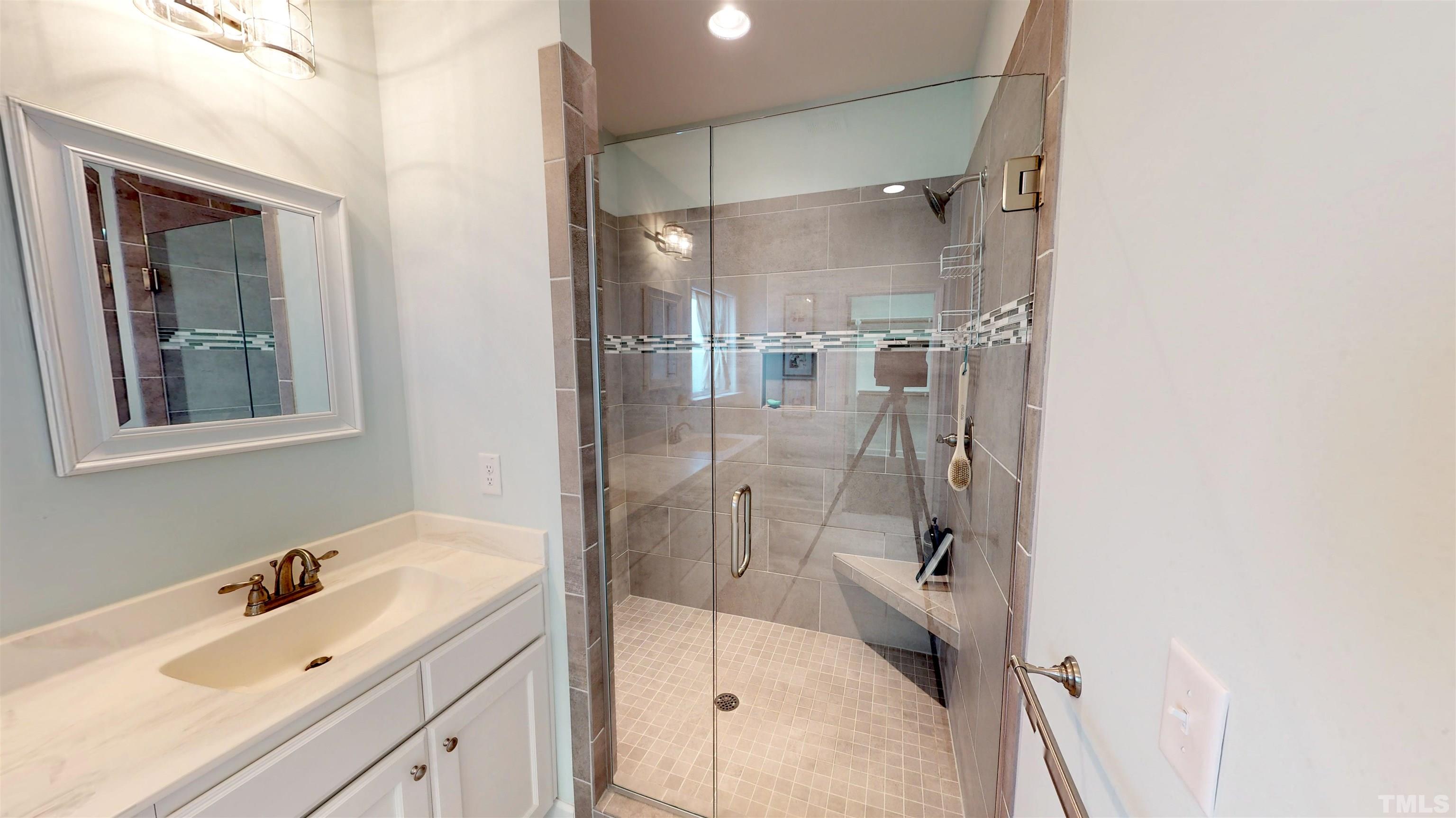 11250 Old Beulah Road Kenly, NC 27542 - Photo 31 of 66 a bathroom with a granite countertop sink mirror and shower
