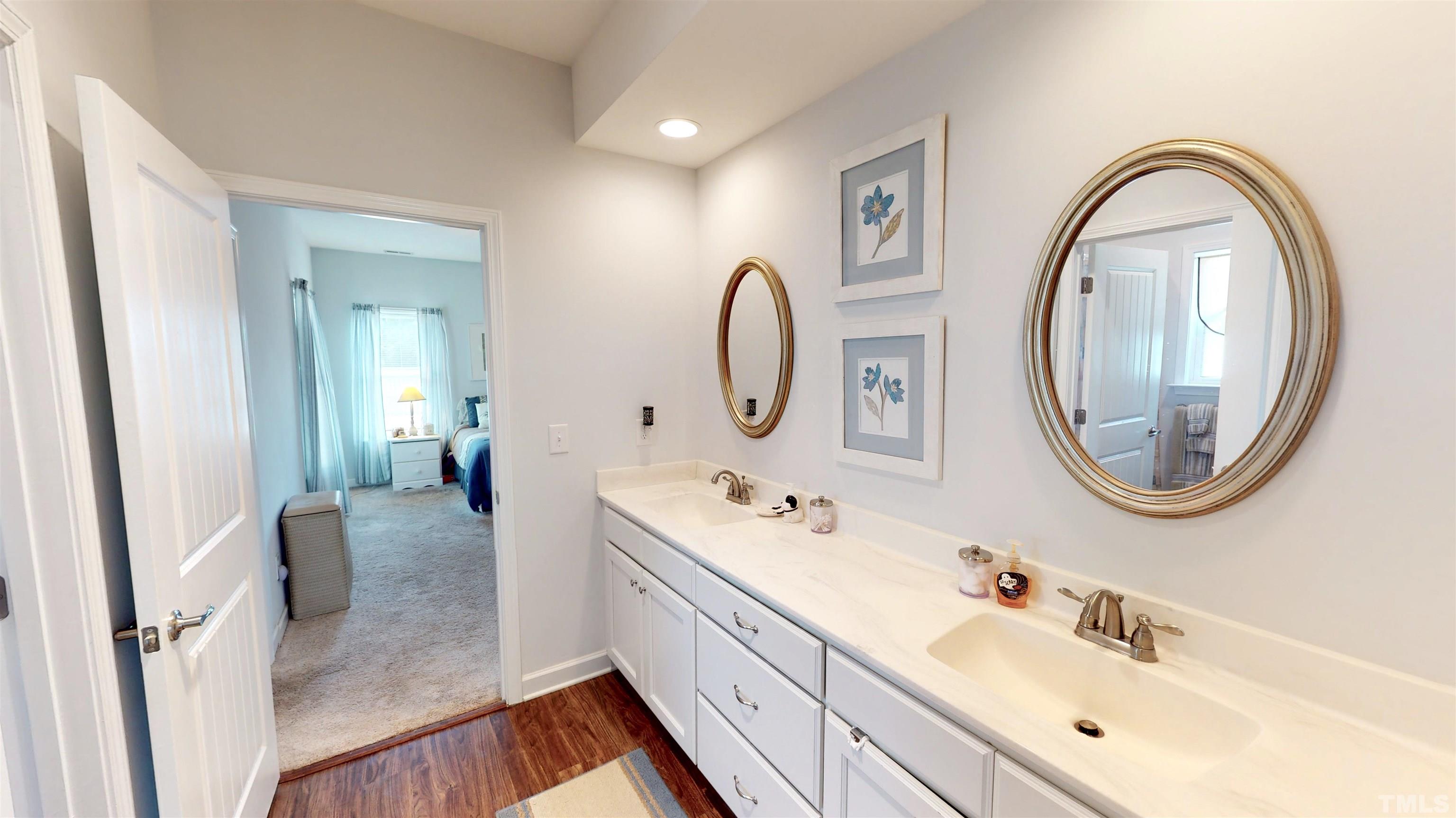 11250 Old Beulah Road Kenly, NC 27542 - Photo 36 of 66 a en suite bathroom with a granite countertop double vanity sink and a mirror