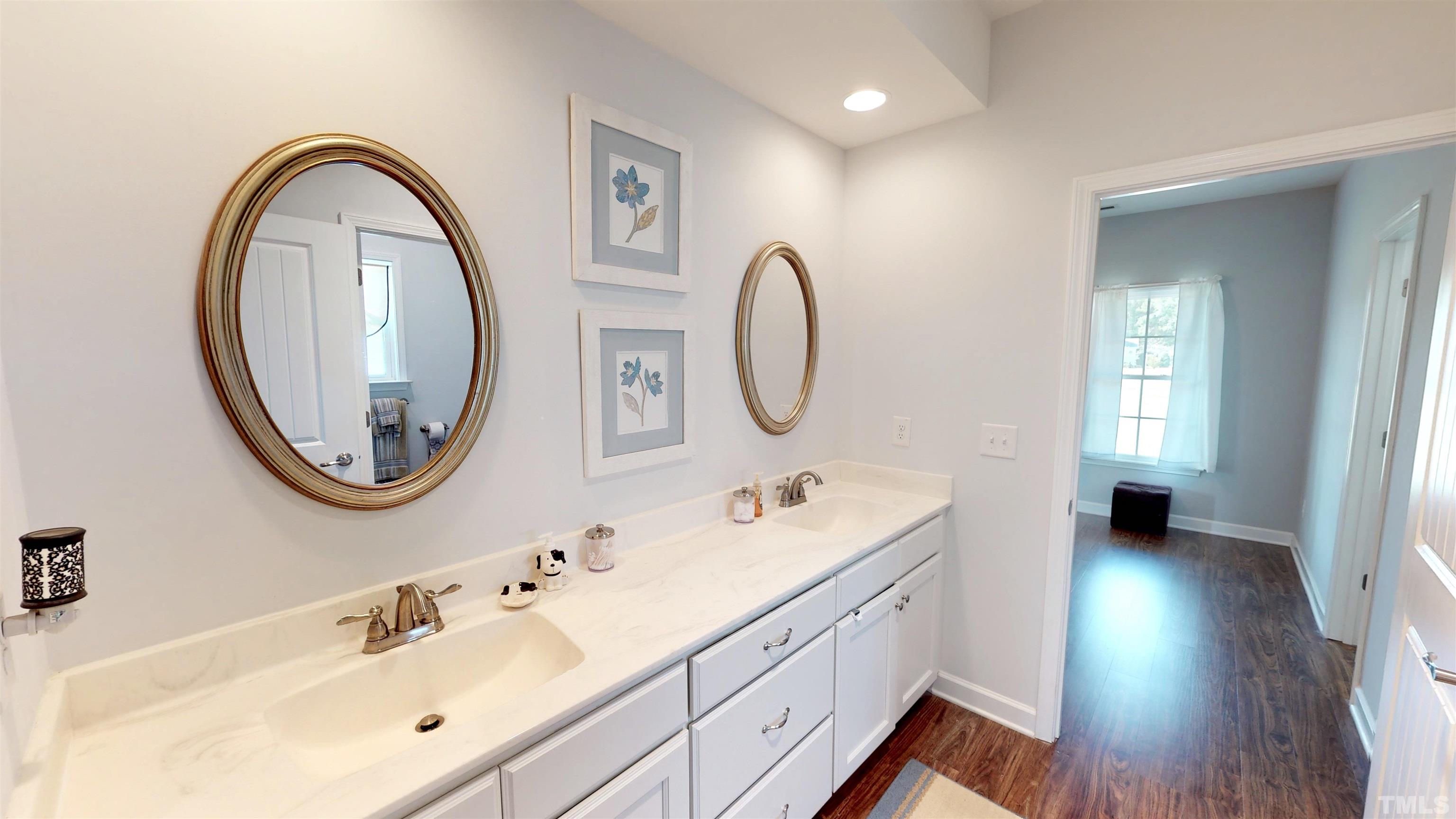 11250 Old Beulah Road Kenly, NC 27542 - Photo 37 of 66 a spacious bathroom with a double vanity sink and a mirror