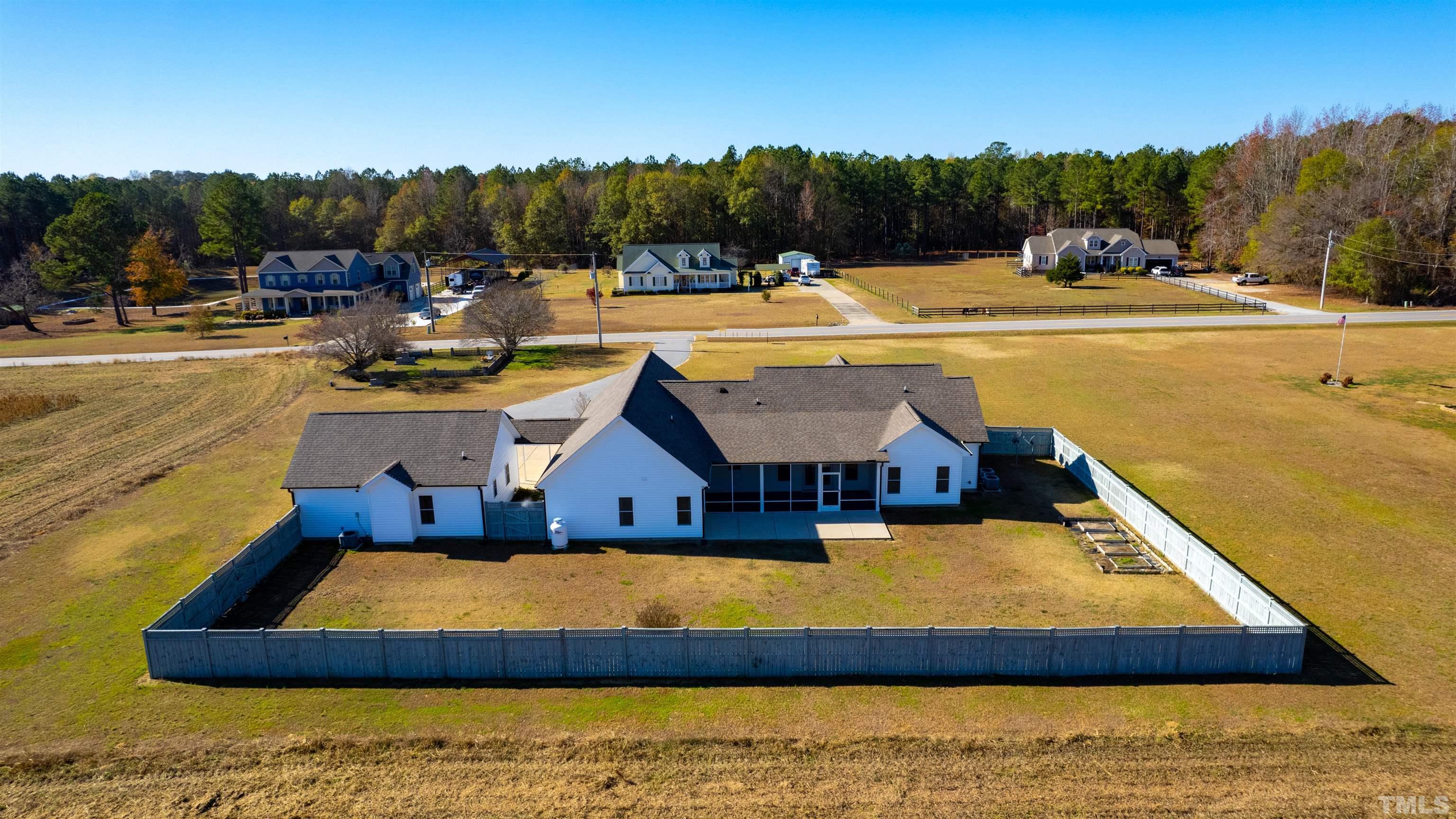 11250 Old Beulah Road Kenly, NC 27542 - Photo 4 of 66 a view of a swimming pool with an outdoor seating