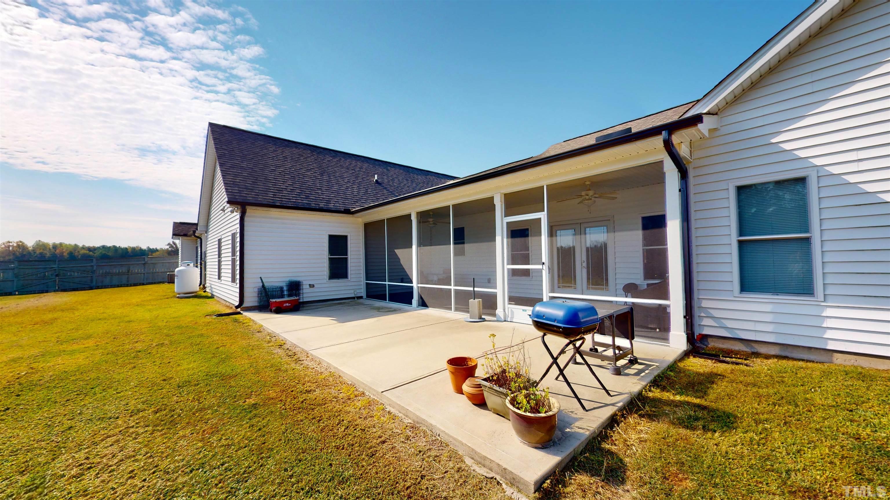 11250 Old Beulah Road Kenly, NC 27542 - Photo 42 of 66 a view of a house with pool and sitting area