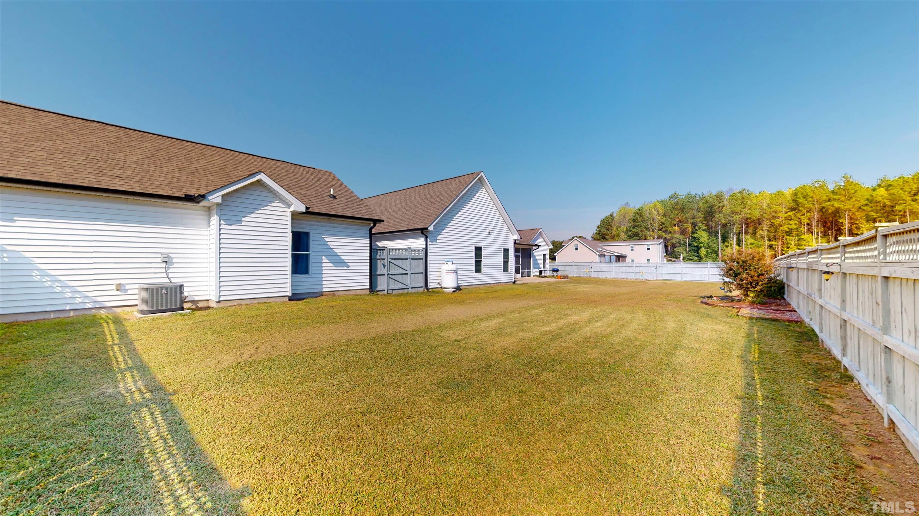 11250 Old Beulah Road Kenly, NC 27542 - Photo 46 of 66 a view of a swimming pool with an outdoor space and seating area