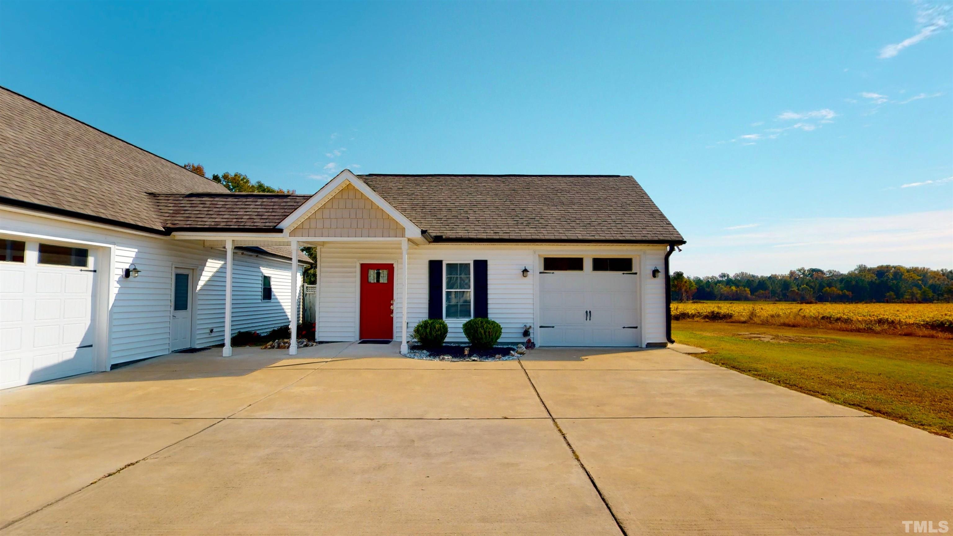 11250 Old Beulah Road Kenly, NC 27542 - Photo 47 of 66 a front view of a house with a yard