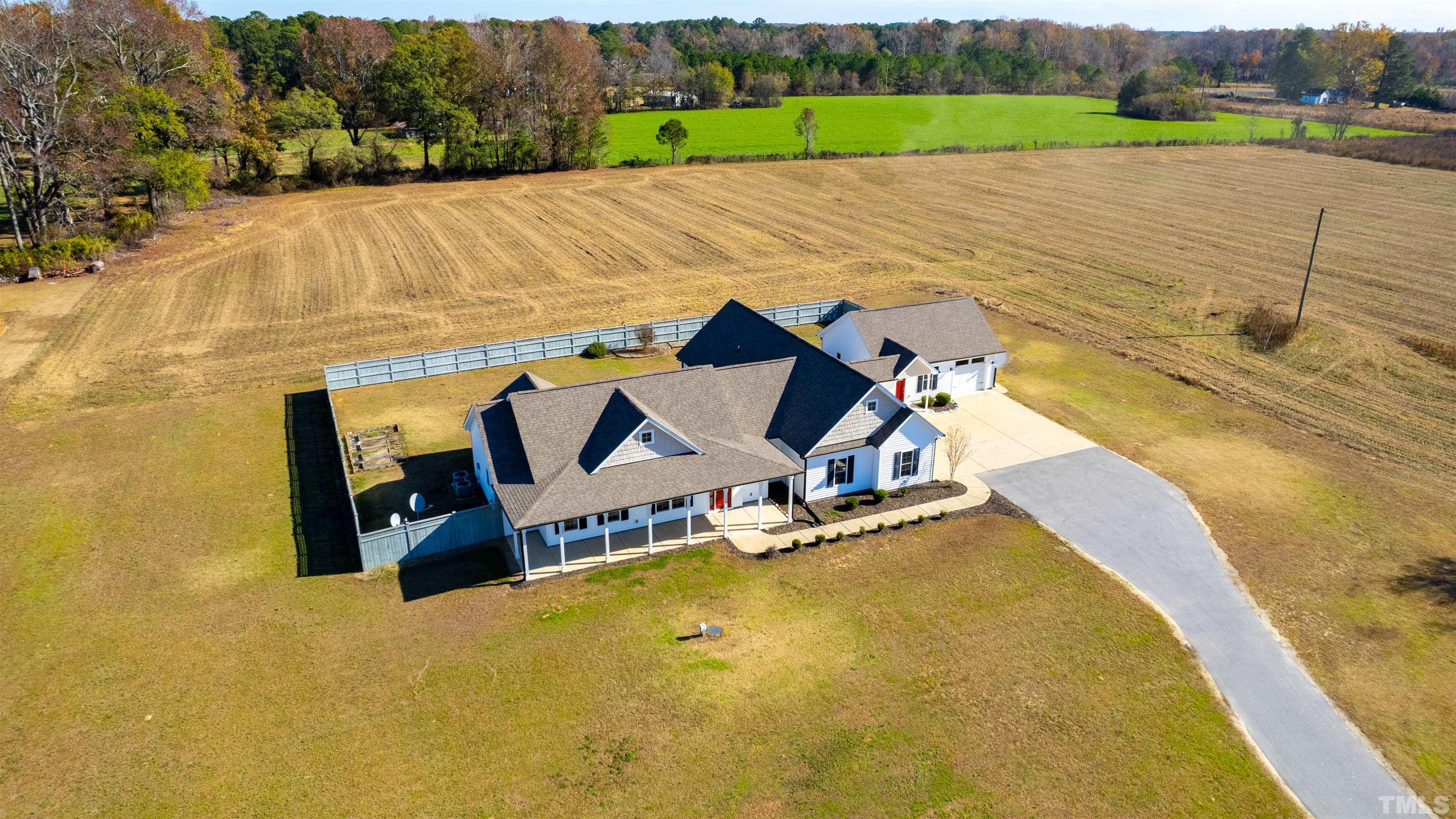 11250 Old Beulah Road Kenly, NC 27542 - Photo 5 of 66 an aerial view of a house with a yard and lake view