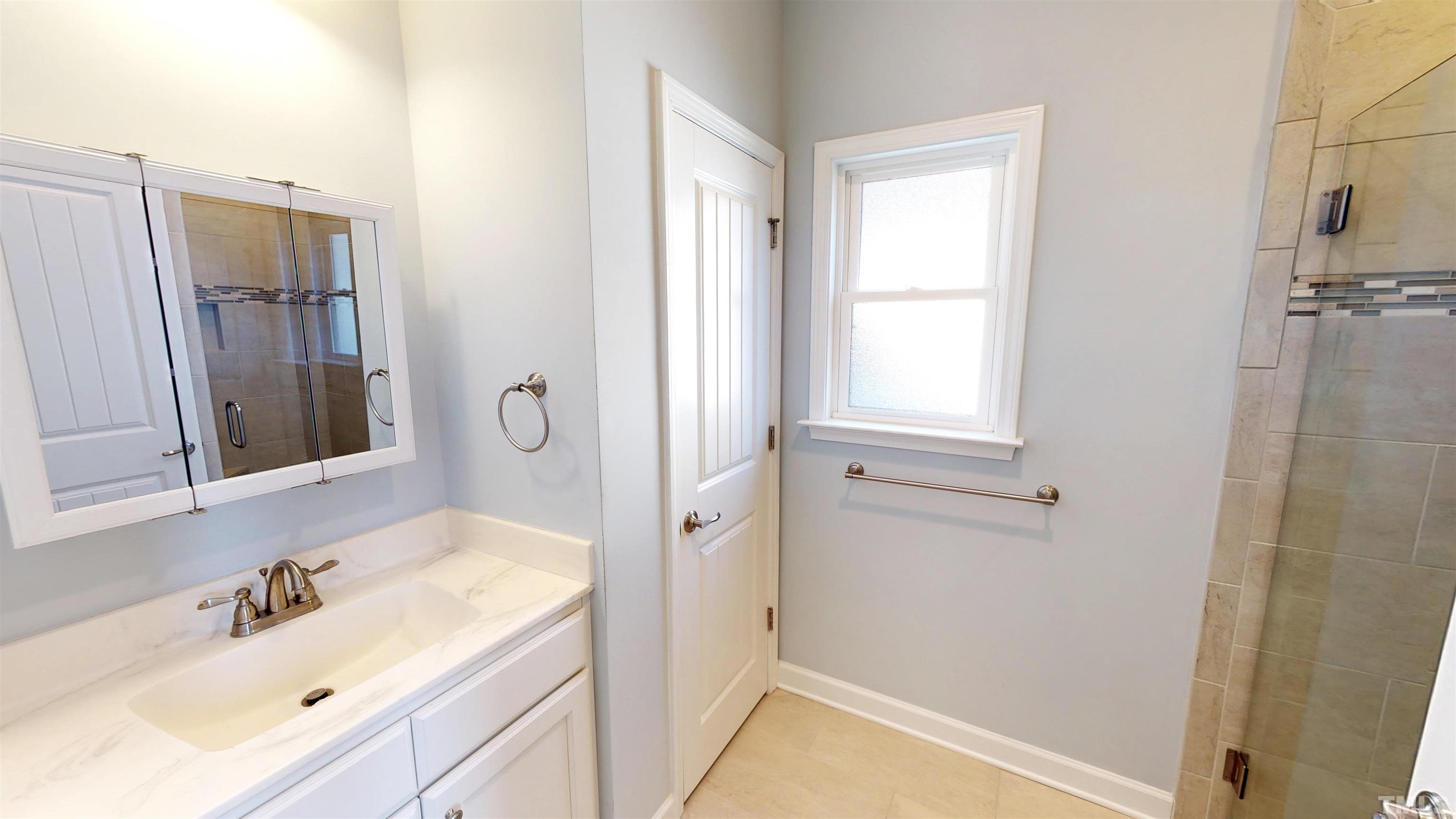 11250 Old Beulah Road Kenly, NC 27542 - Photo 54 of 66 a bathroom with a sink and a mirror