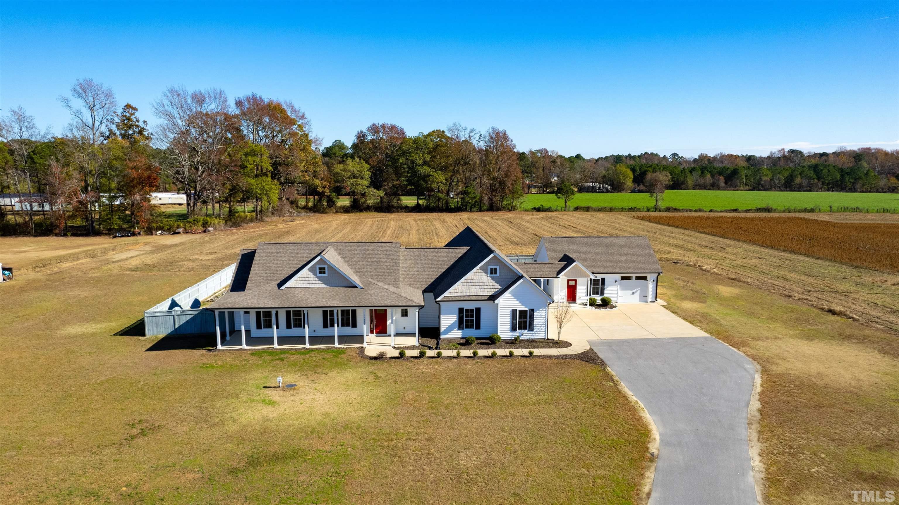 11250 Old Beulah Road Kenly, NC 27542 - Photo 56 of 66 a aerial view of a house with a big yard