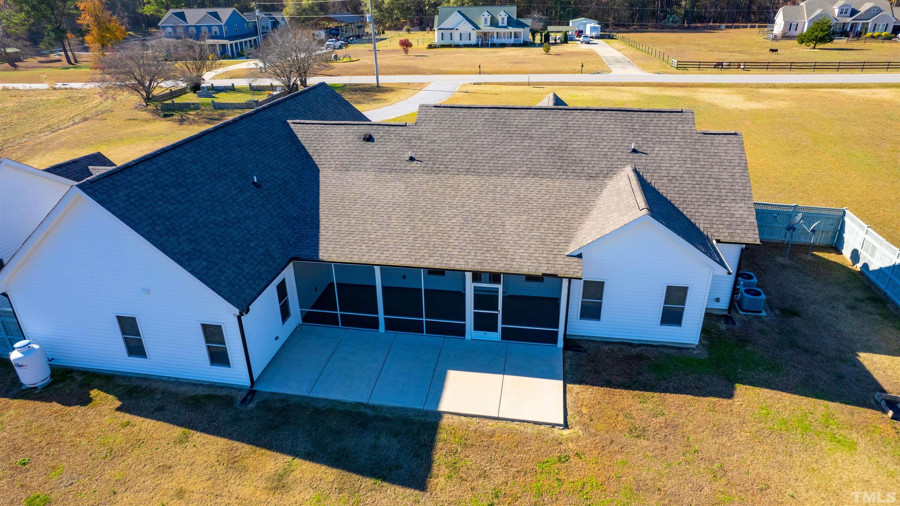 11250 Old Beulah Road Kenly, NC 27542 - Photo 62 of 66 a view of a house with a swimming pool