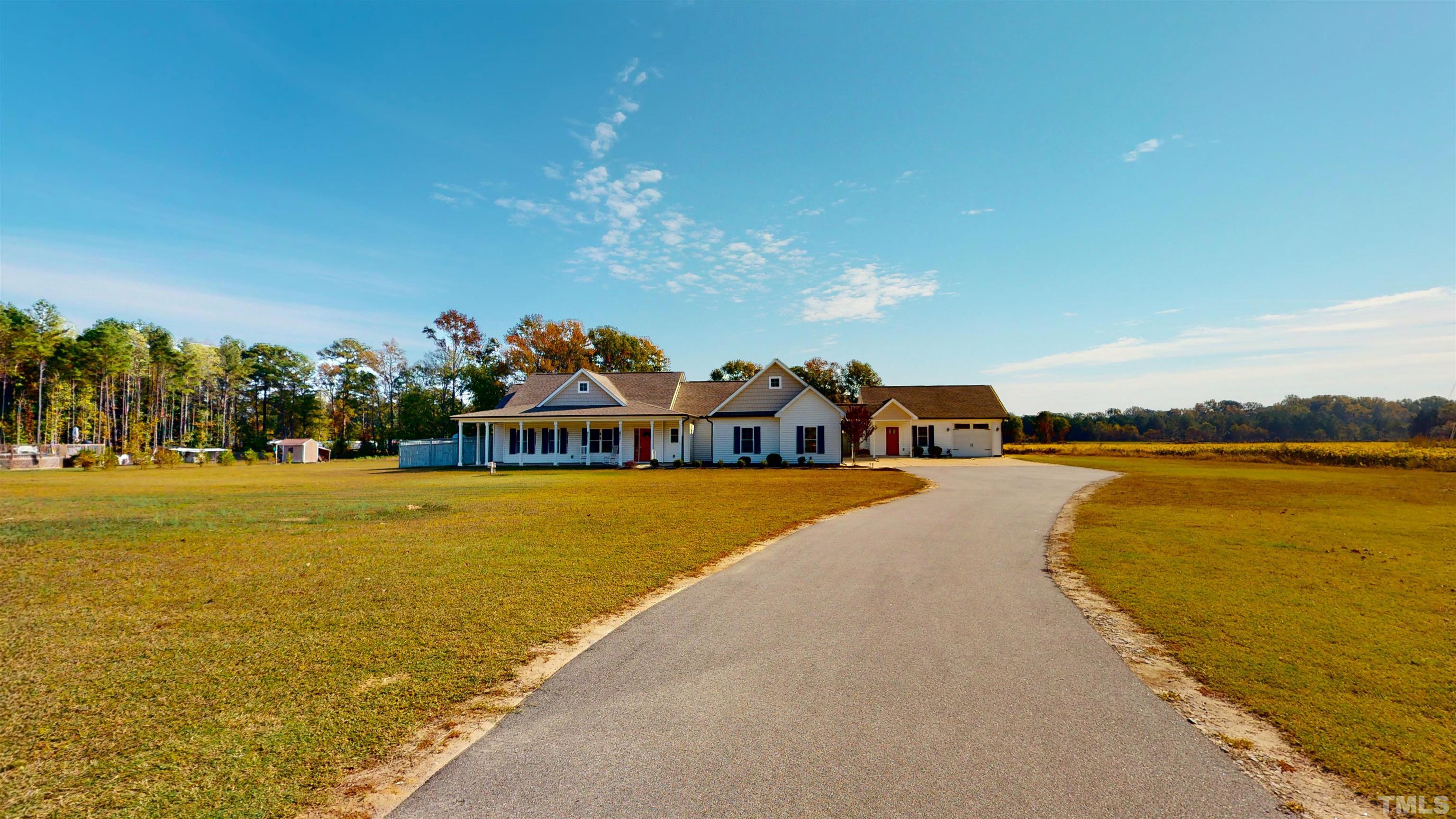 11250 Old Beulah Road Kenly, NC 27542 - Photo 7 of 66 a view of a lake with a houses