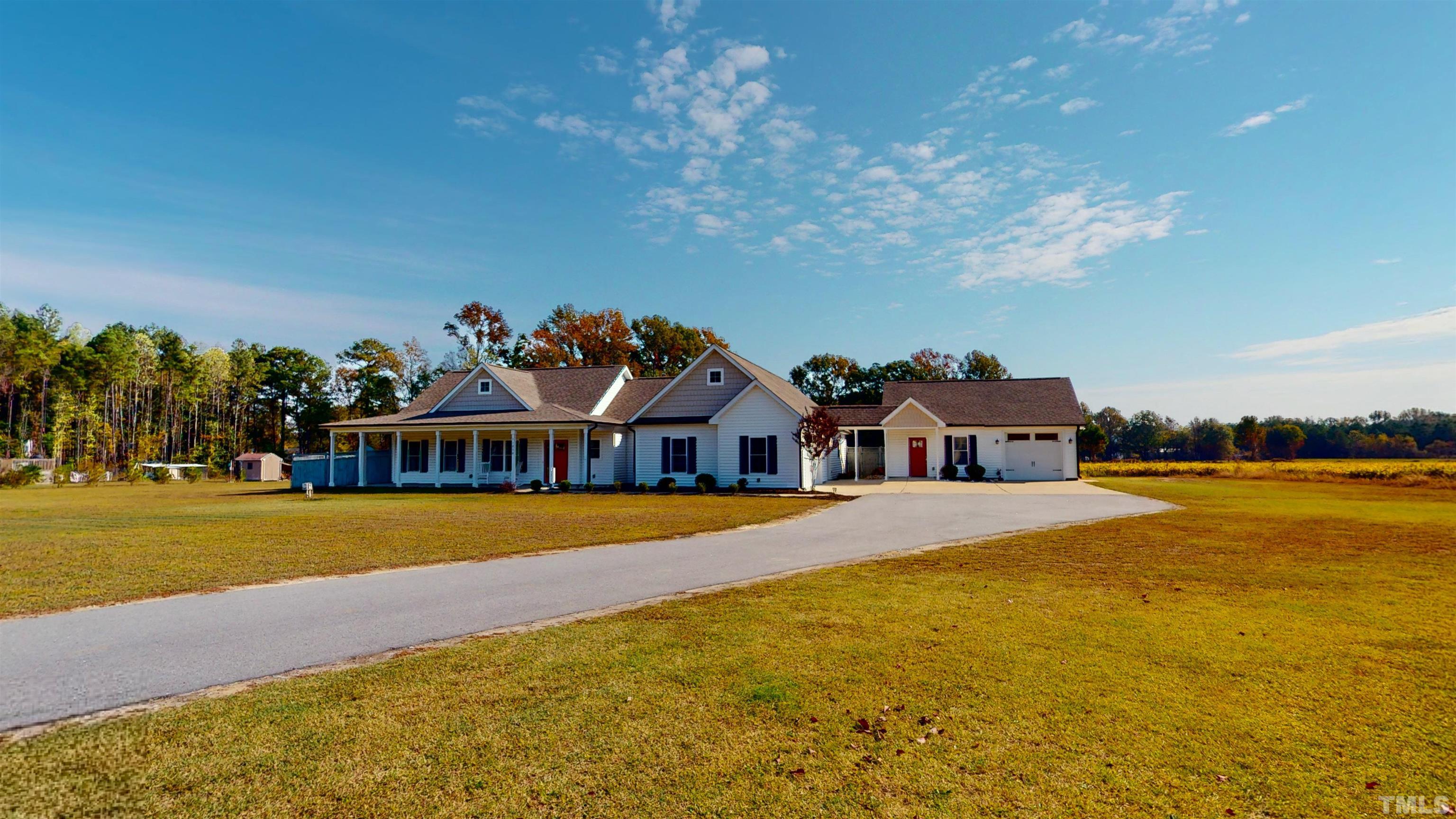 11250 Old Beulah Road Kenly, NC 27542 - Photo 8 of 66 a front view of a house with a yard and ocean view