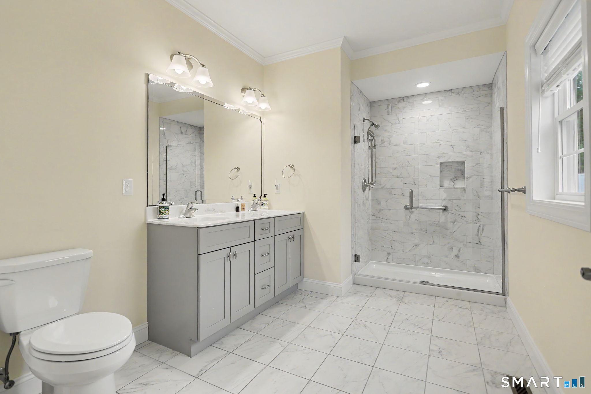 223 Meadow Brook Road, Unit 223 Oxford, CT 06478 - Photo 18 of 34 a bathroom with a double vanity sink toilet and shower