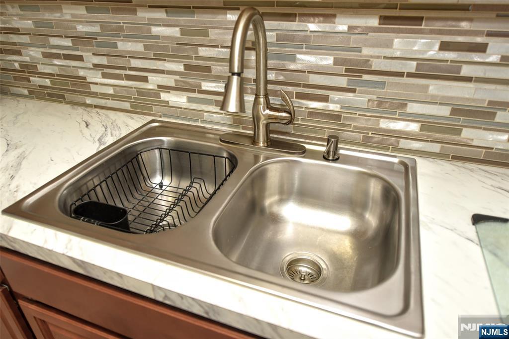 125 Prospect Avenue, Unit 3J Hackensack, NJ 07601 - Photo 16 of 25 a close view of sink and tap