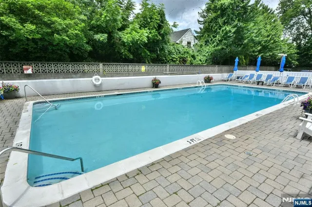 a view of a swimming pool with a patio