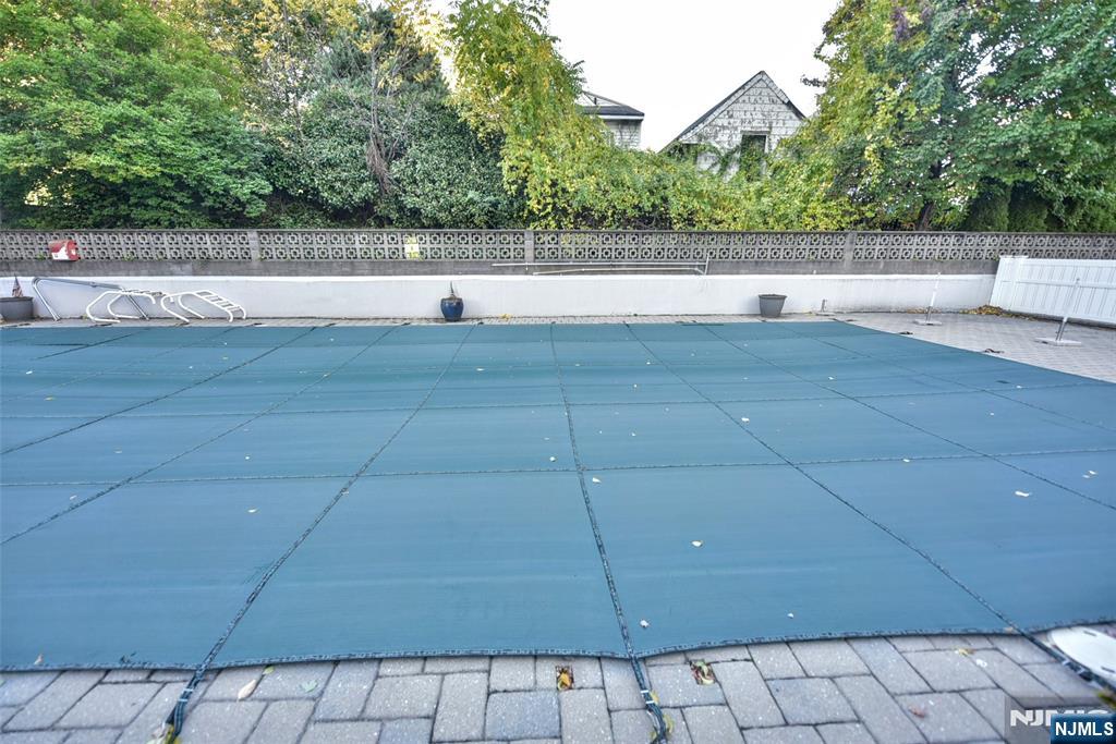 125 Prospect Avenue, Unit 3J Hackensack, NJ 07601 - Photo 23 of 25 a view of a green field with trees in the background