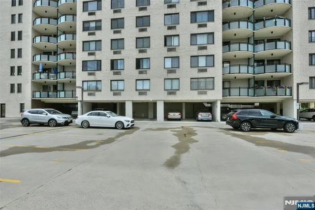 a building with cars parked in front of it
