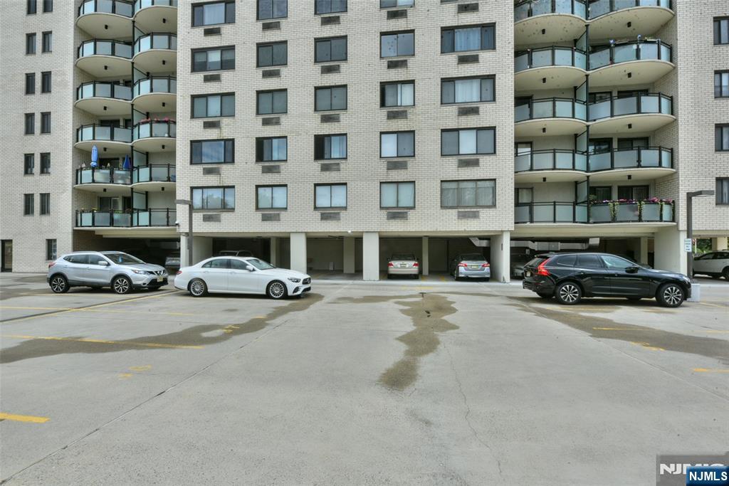 125 Prospect Avenue, Unit 3J Hackensack, NJ 07601 - Photo 24 of 25 a building with cars parked in front of it