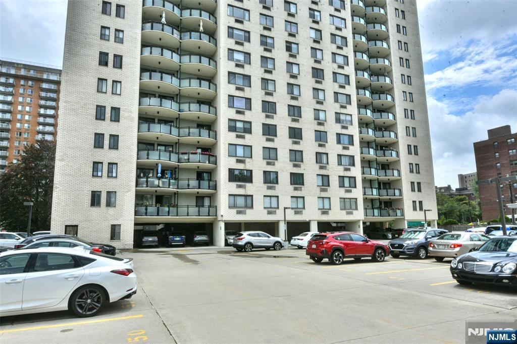 125 Prospect Avenue, Unit 3J Hackensack, NJ 07601 - Photo 25 of 25 a car parked in front of a building