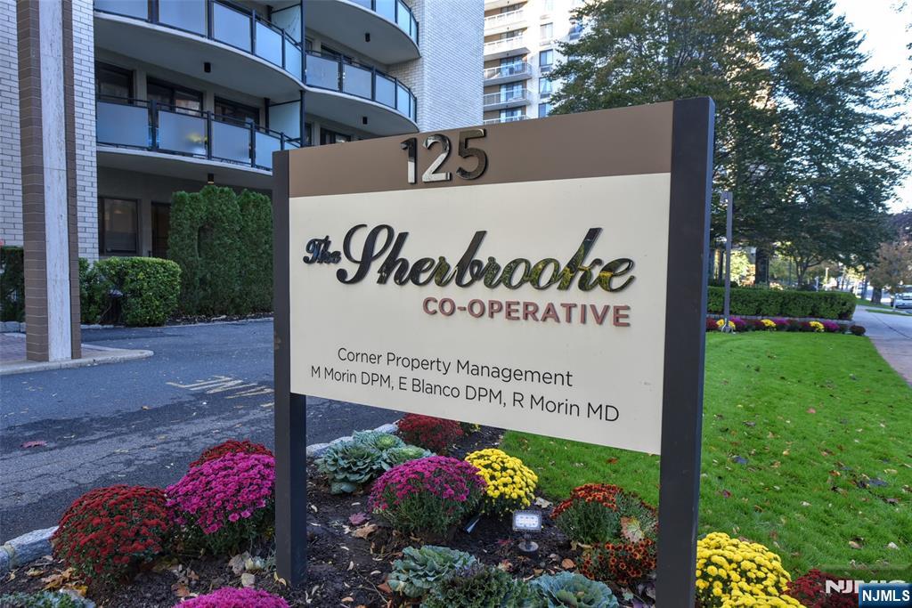 125 Prospect Avenue, Unit 3J Hackensack, NJ 07601 - Photo 4 of 25 a sign on the side of the road