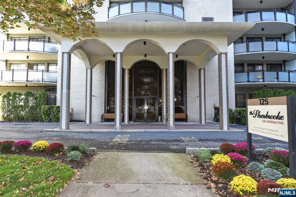 125 Prospect Avenue, Unit 3J Hackensack, NJ 07601 - Photo 5 of 25 a front view of a house with a garden