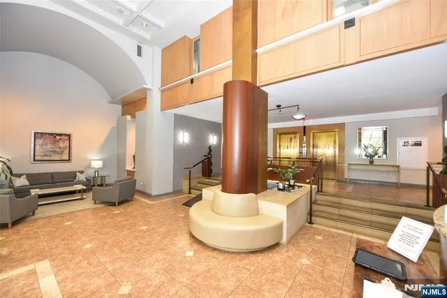 a lobby with furniture and window