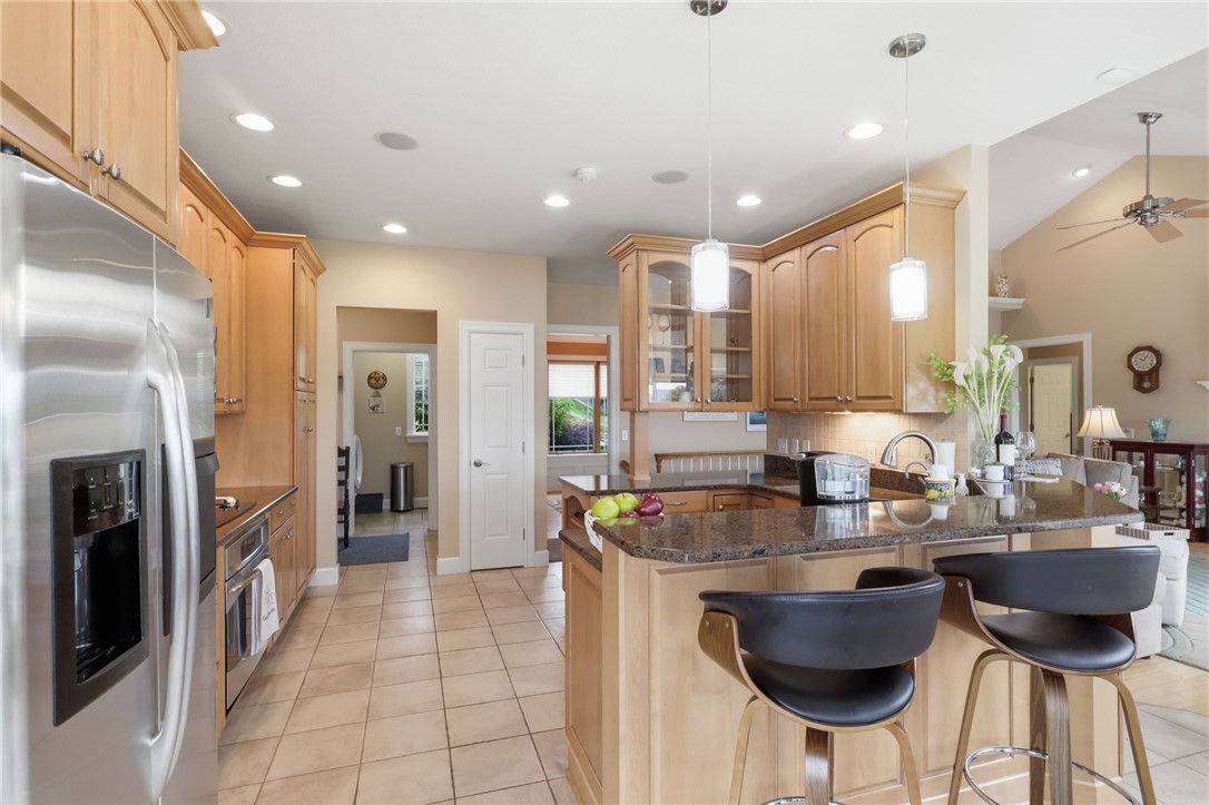 4536 Crystal Ridge Circle Gorham, NY 14424 - Photo 12 of 48 Kitchen features a modern breakfast bar that offers added convenience for casual dining, morning coffee, or extra seating while entertaining guests. Convenient instant hot water dispenser.