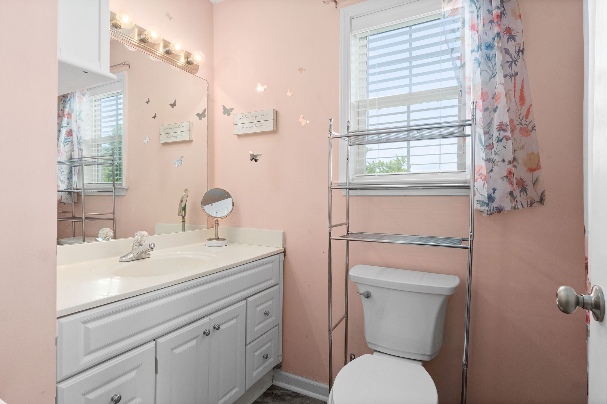 615 Avondale Road Oak Grove, KY 42262 - Photo 14 of 35 a bathroom with a toilet sink vanity and mirror