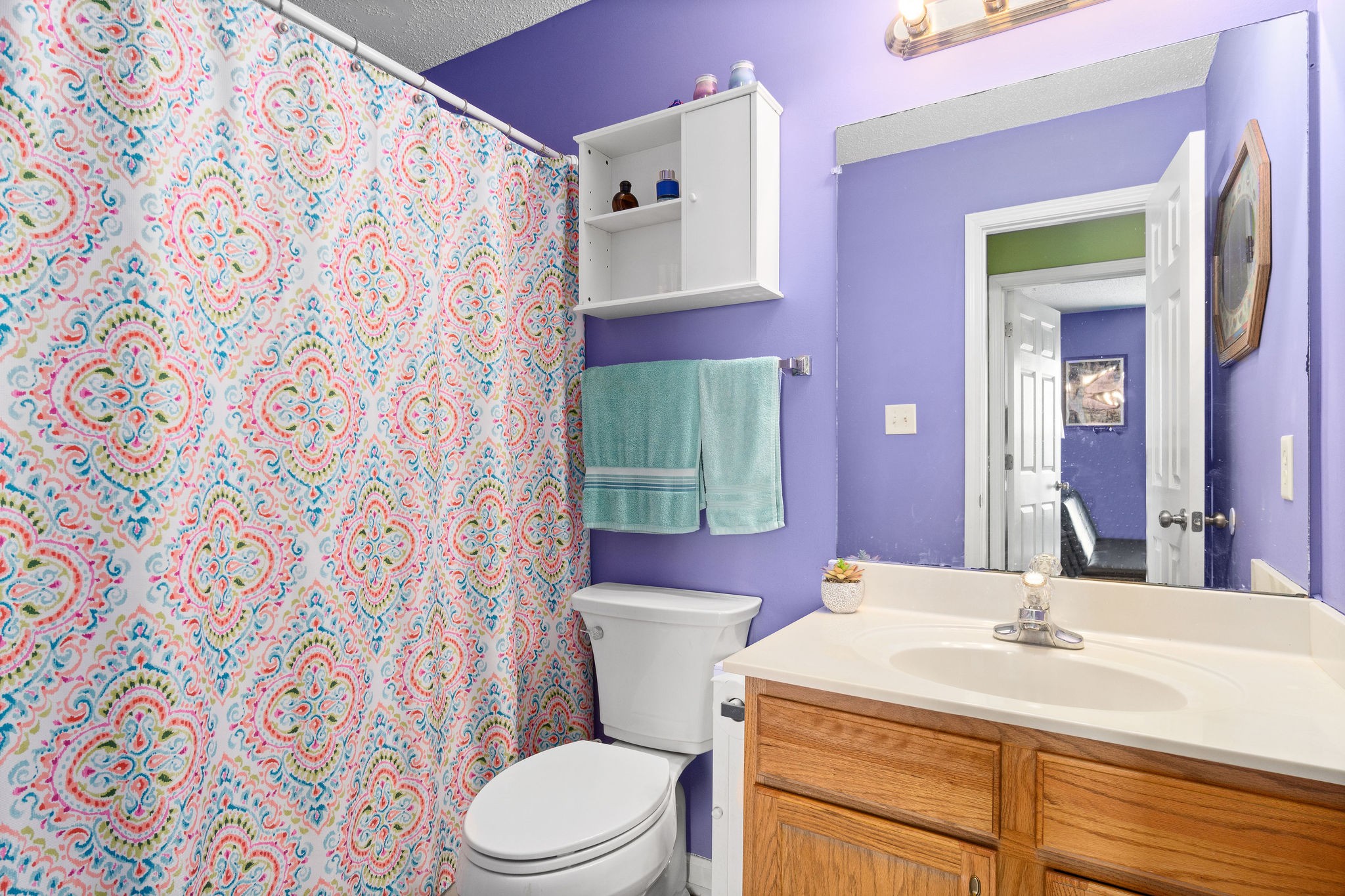 615 Avondale Road Oak Grove, KY 42262 - Photo 20 of 35 a bathroom with a sink a toilet and shower curtain