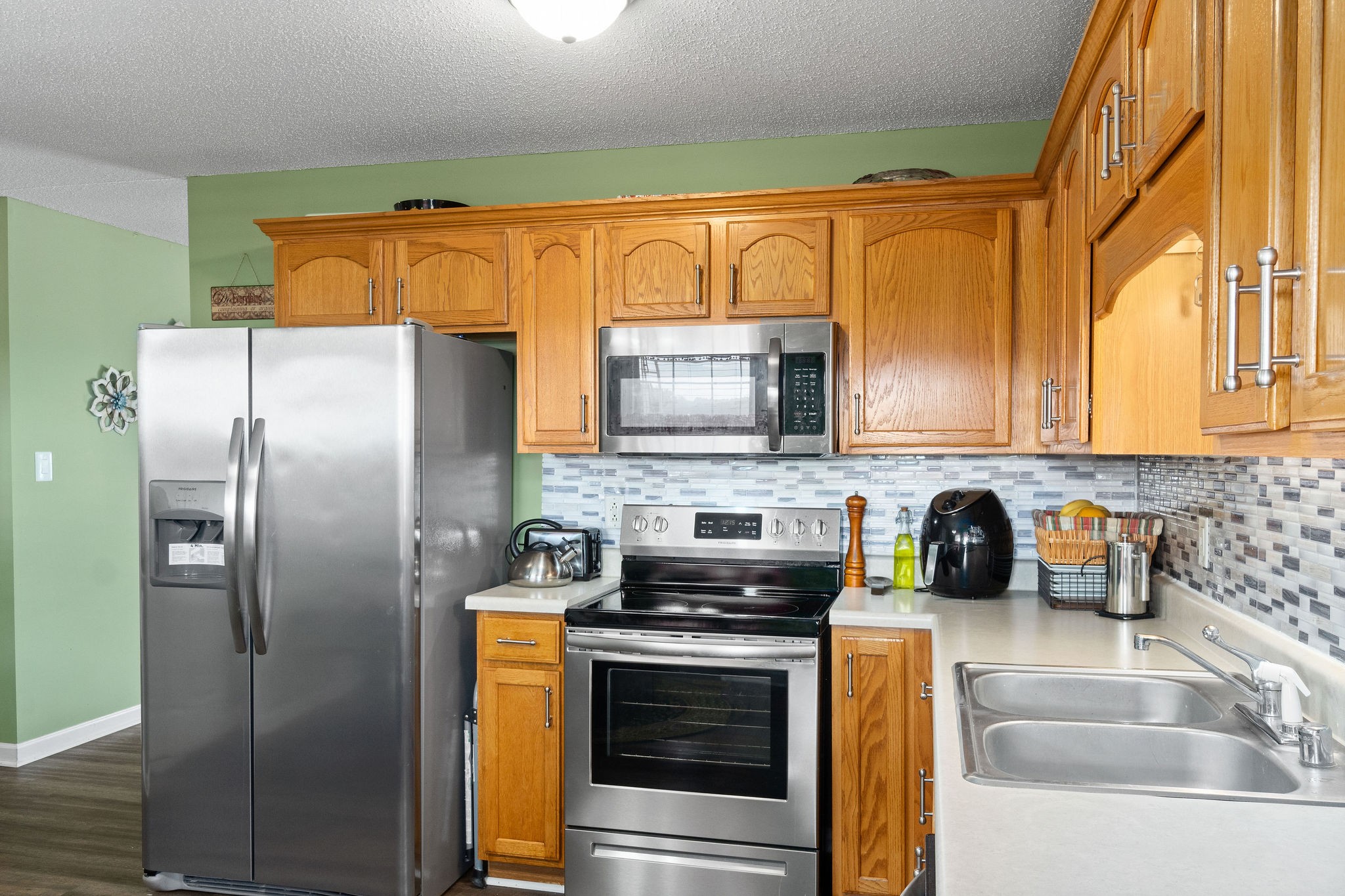 615 Avondale Road Oak Grove, KY 42262 - Photo 8 of 35 a kitchen with stainless steel appliances granite countertop a refrigerator a stove top oven a sink and dishwasher
