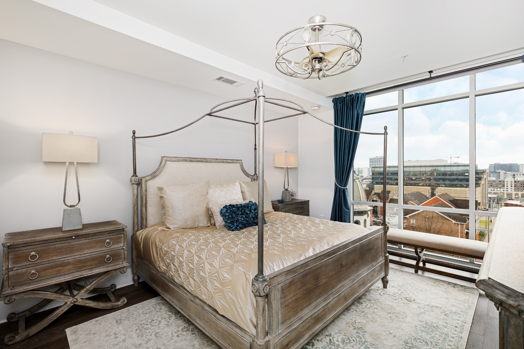 20 Rutledge Street, Unit 508 Nashville, TN 37210 - Photo 16 of 47 a bedroom with a bed and a chandelier