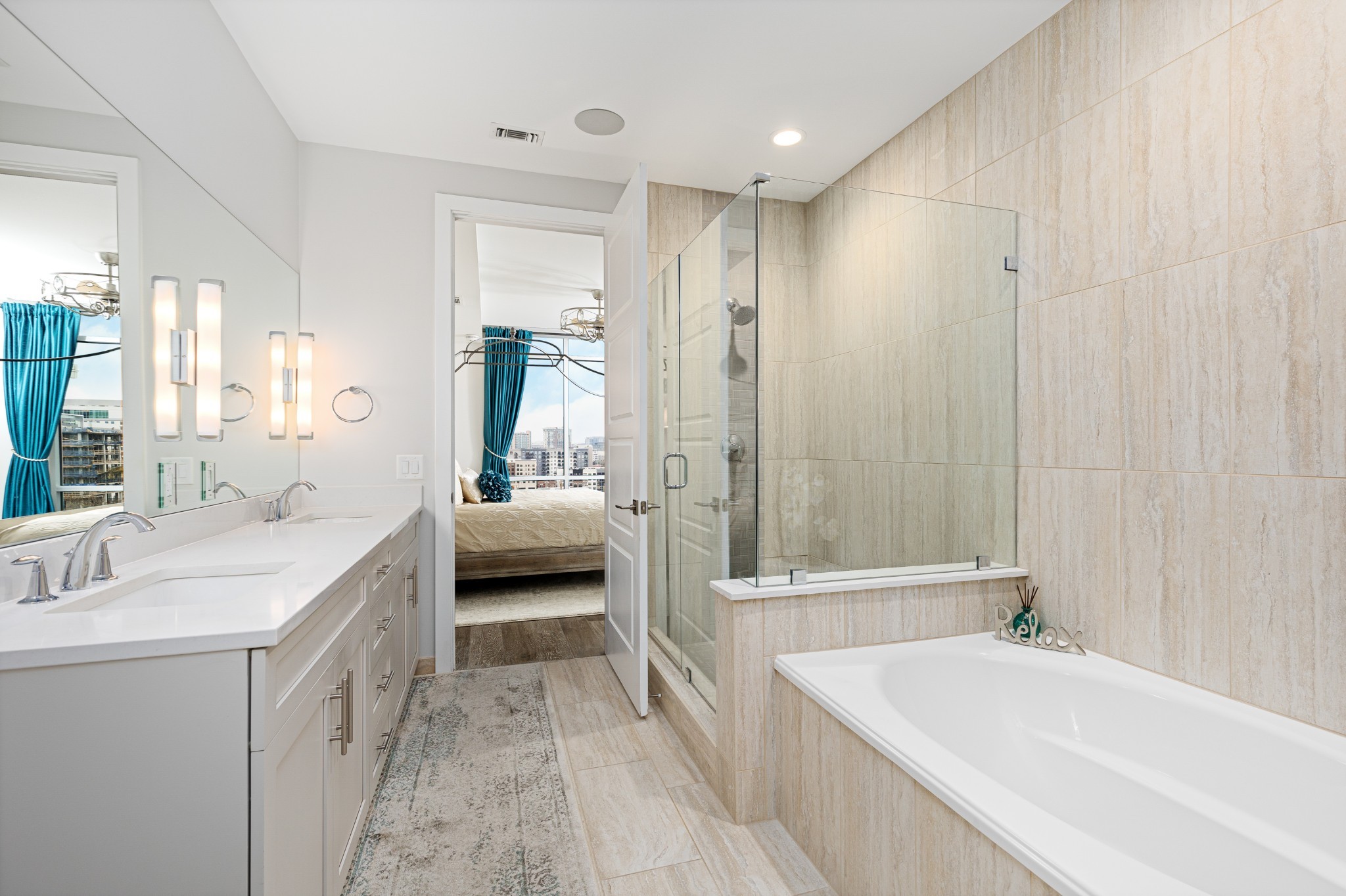 20 Rutledge Street, Unit 508 Nashville, TN 37210 - Photo 20 of 47 a bathroom with a tub a sink a mirror and a shower