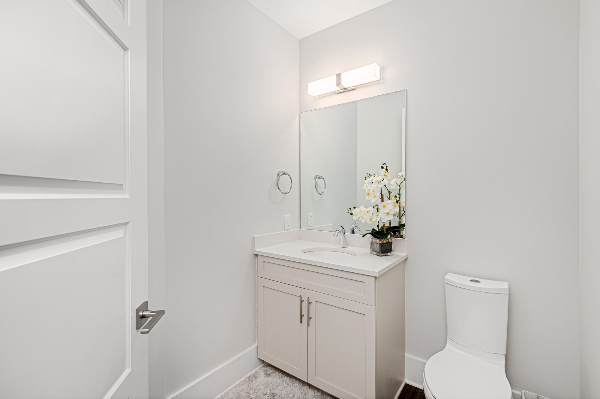 20 Rutledge Street, Unit 508 Nashville, TN 37210 - Photo 29 of 47 a bathroom with a sink a toilet and mirror