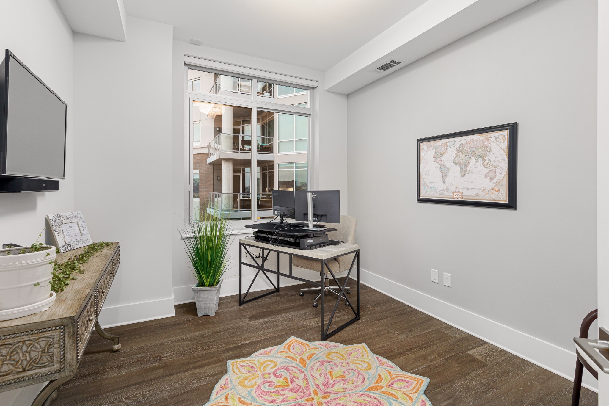 20 Rutledge Street, Unit 508 Nashville, TN 37210 - Photo 30 of 47 a workspace with furniture and wooden floor