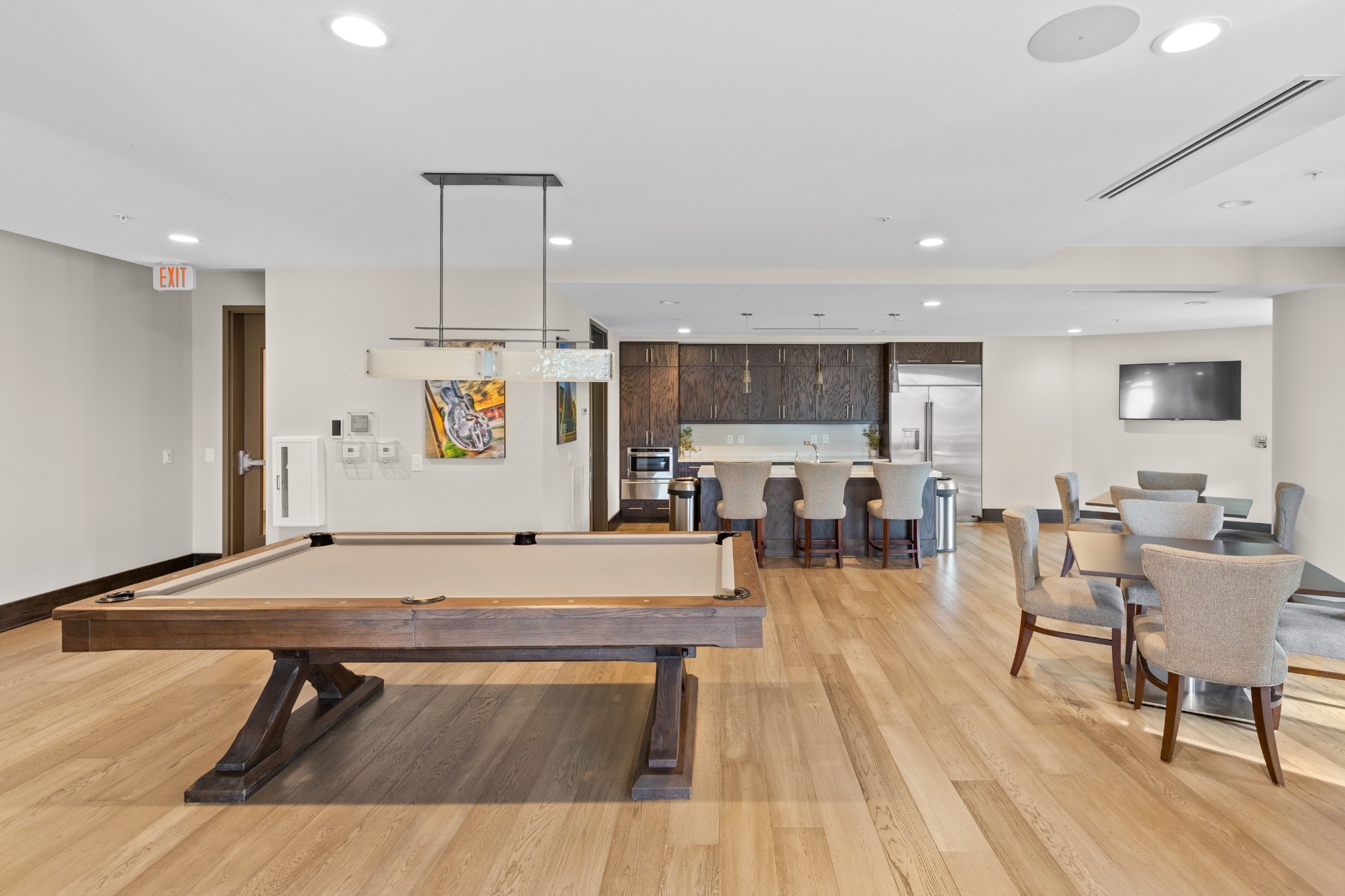 20 Rutledge Street, Unit 508 Nashville, TN 37210 - Photo 33 of 47 a view of a dining hall with furniture and wooden floor