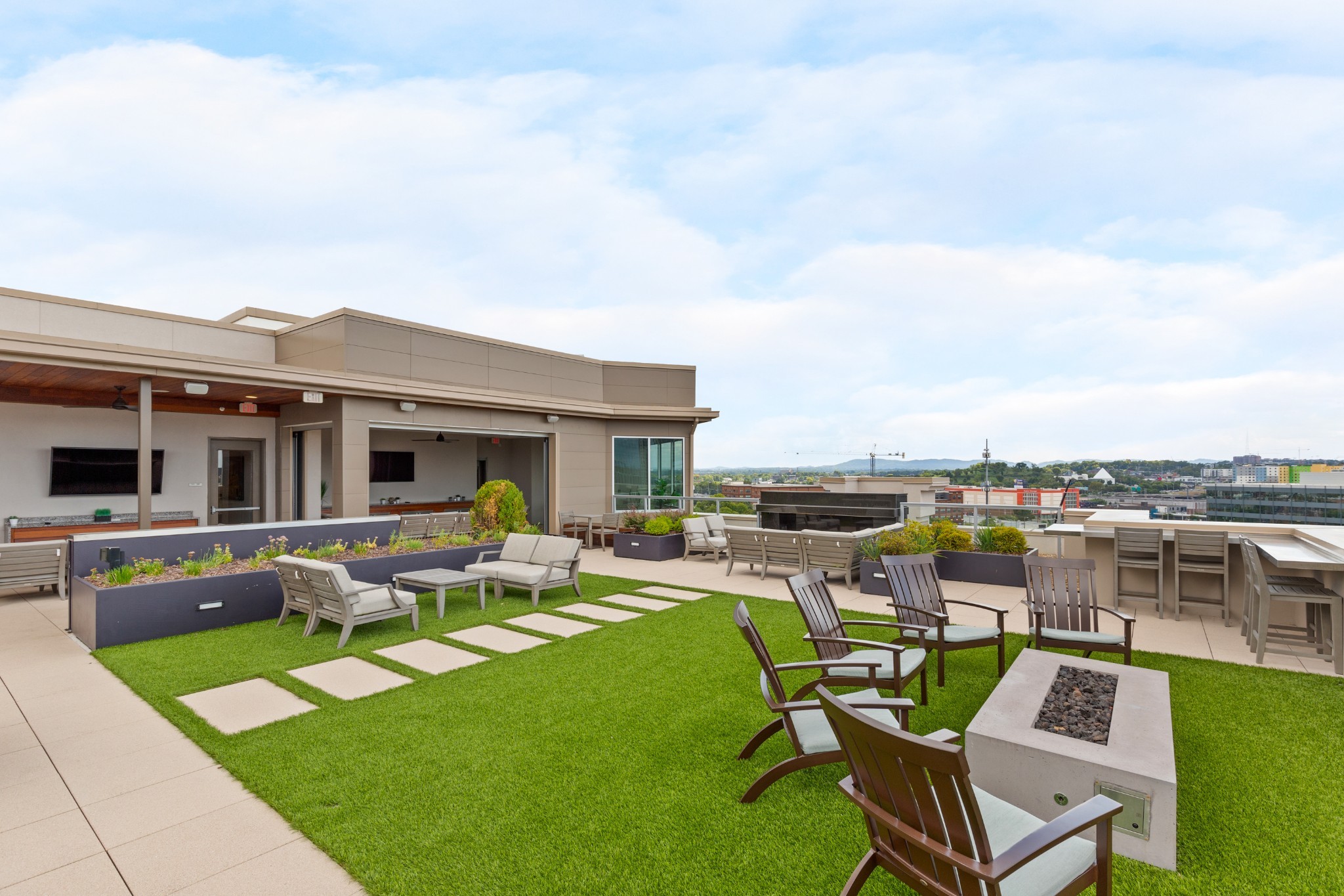 20 Rutledge Street, Unit 508 Nashville, TN 37210 - Photo 41 of 47 a view of a patio with couches chairs and a table and chairs
