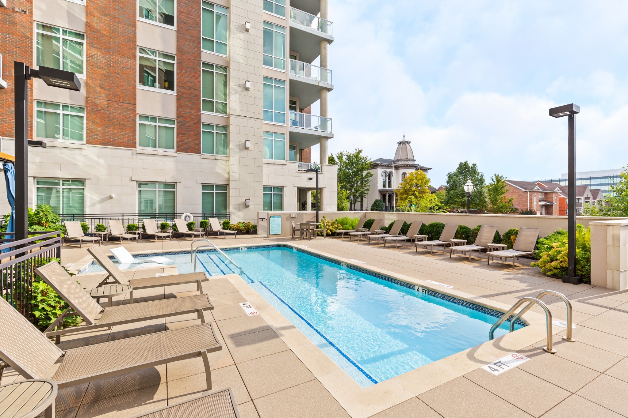 20 Rutledge Street, Unit 508 Nashville, TN 37210 - Photo 46 of 47 a view of a swimming pool with a lounge chairs