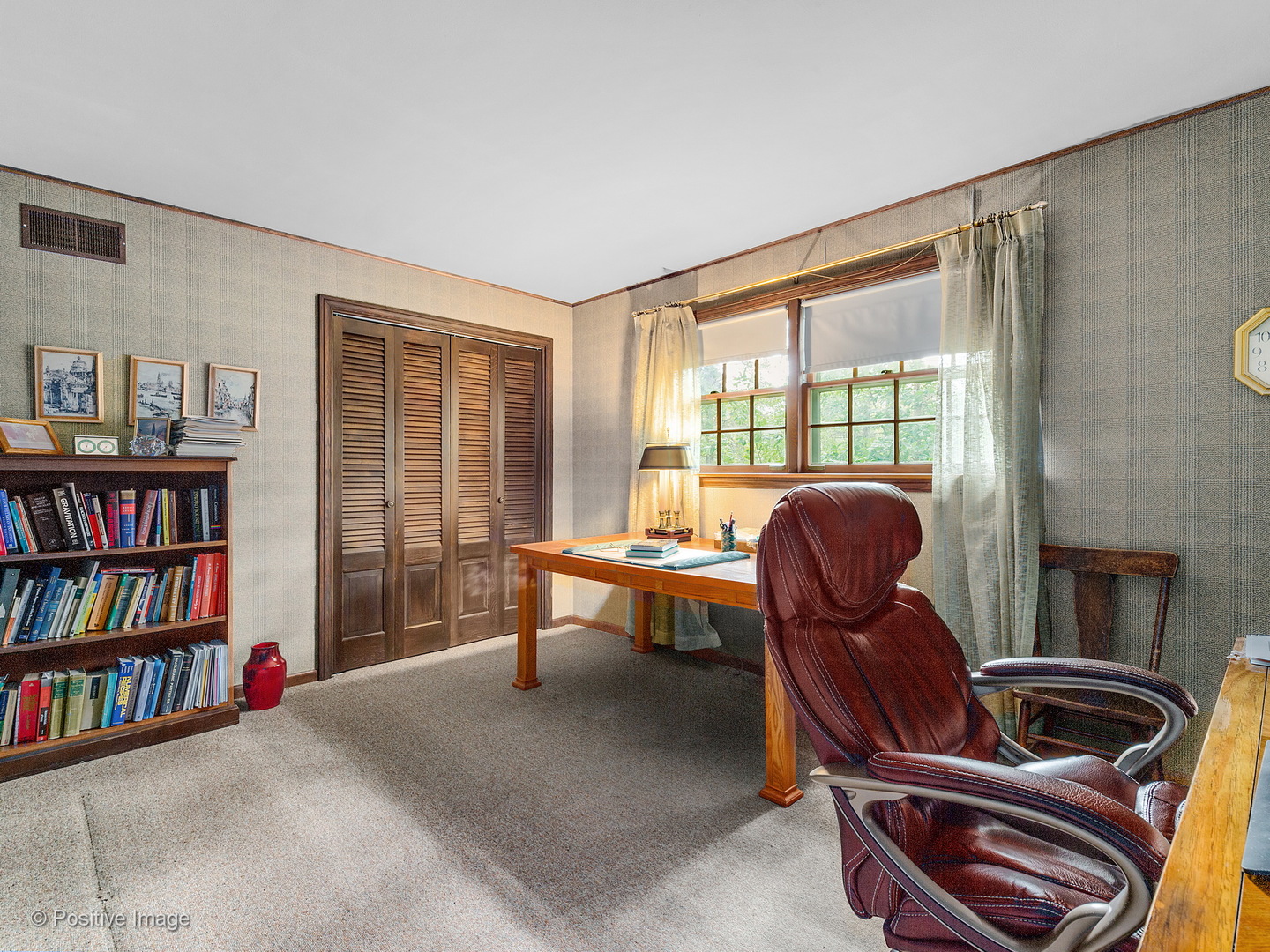 S206 Summit Drive Winfield, IL 60190 - Photo 17 of 34 a work room with furniture and a book shelf