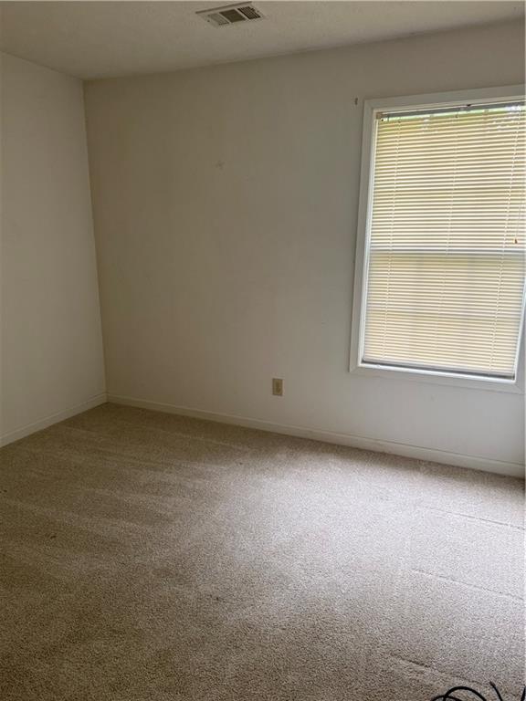 682 Bridge Way Lithonia, GA 30058 - Photo 22 of 25 an empty room with a window