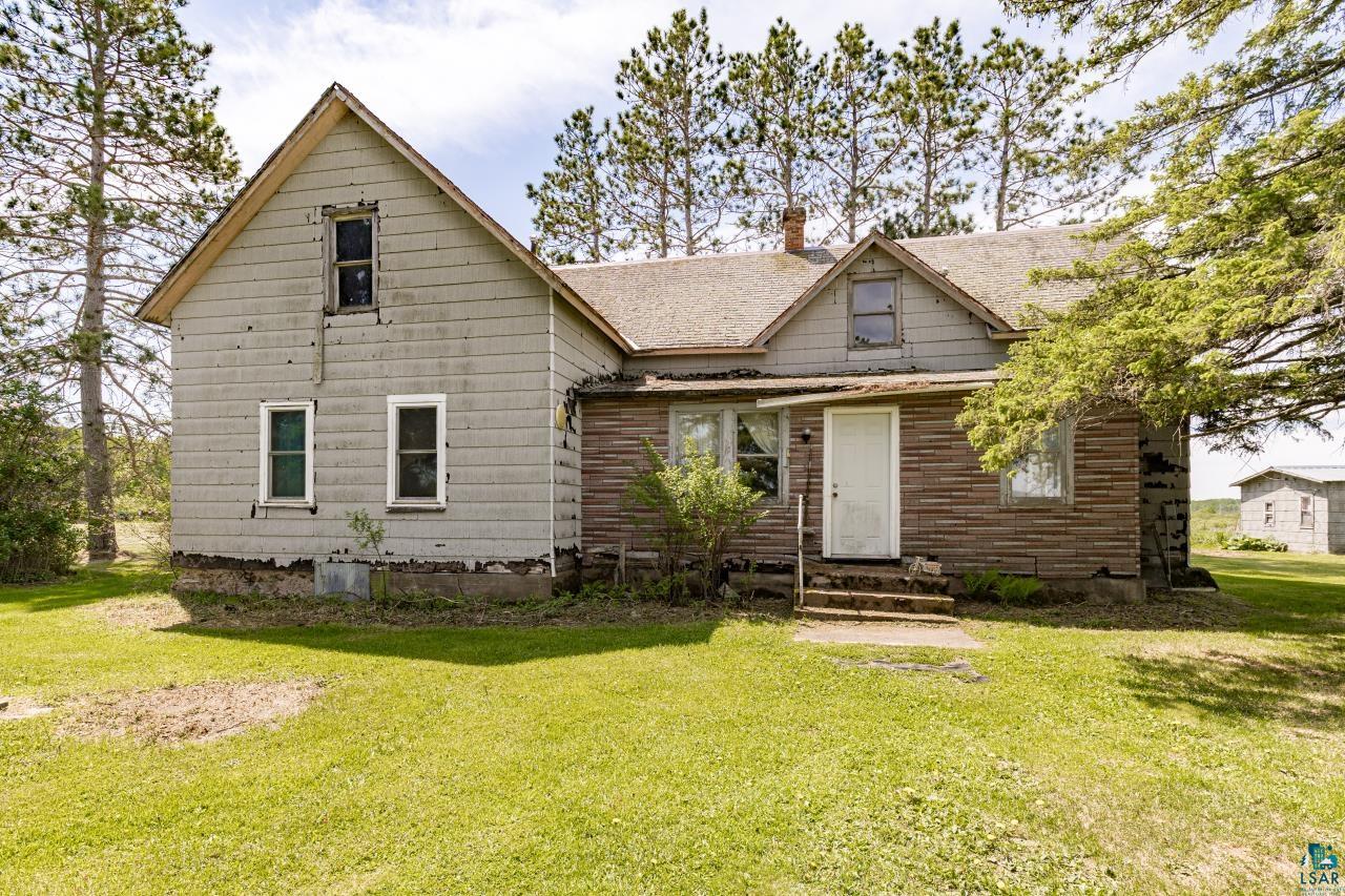 6606 Metso Road Kettle River, MN 55757 - Photo 37 of 84 Gabled roofline house with light-colored siding and a contrasting wood-look lower exterior