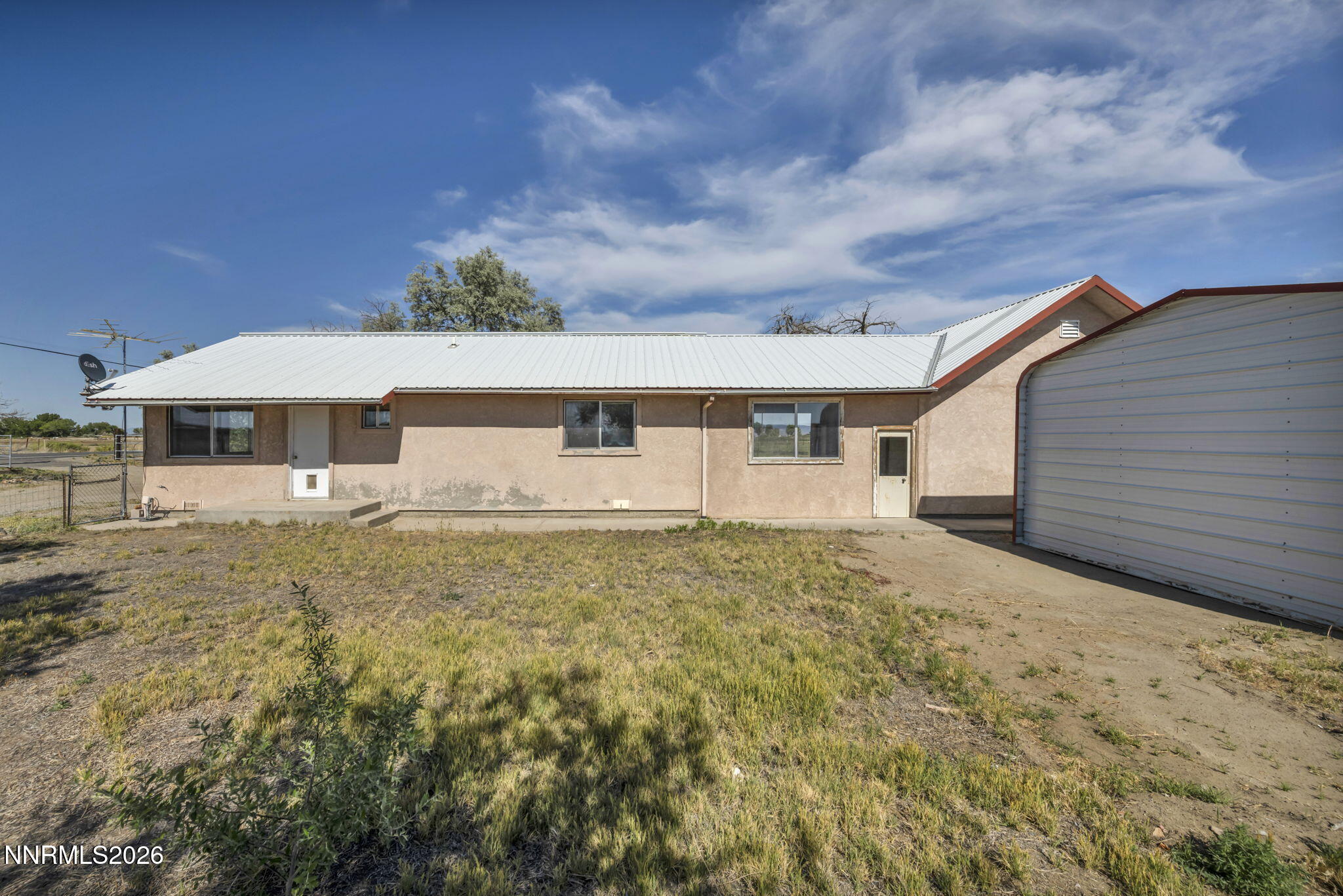 5250 Stillwater Road Fallon, NV 89406 - Photo 4 of 53 a backyard of a house with table and chairs