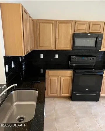 a bathroom with a sink a vanity and a bathtub