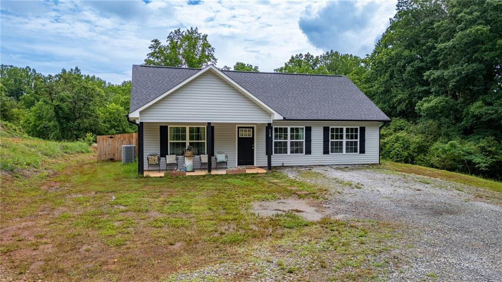 118 Wash Rider Road Dahlonega, GA 30533 - Photo 2 of 37 a house view with a garden space