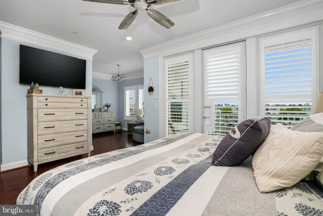 a bedroom with a bed and a television in it